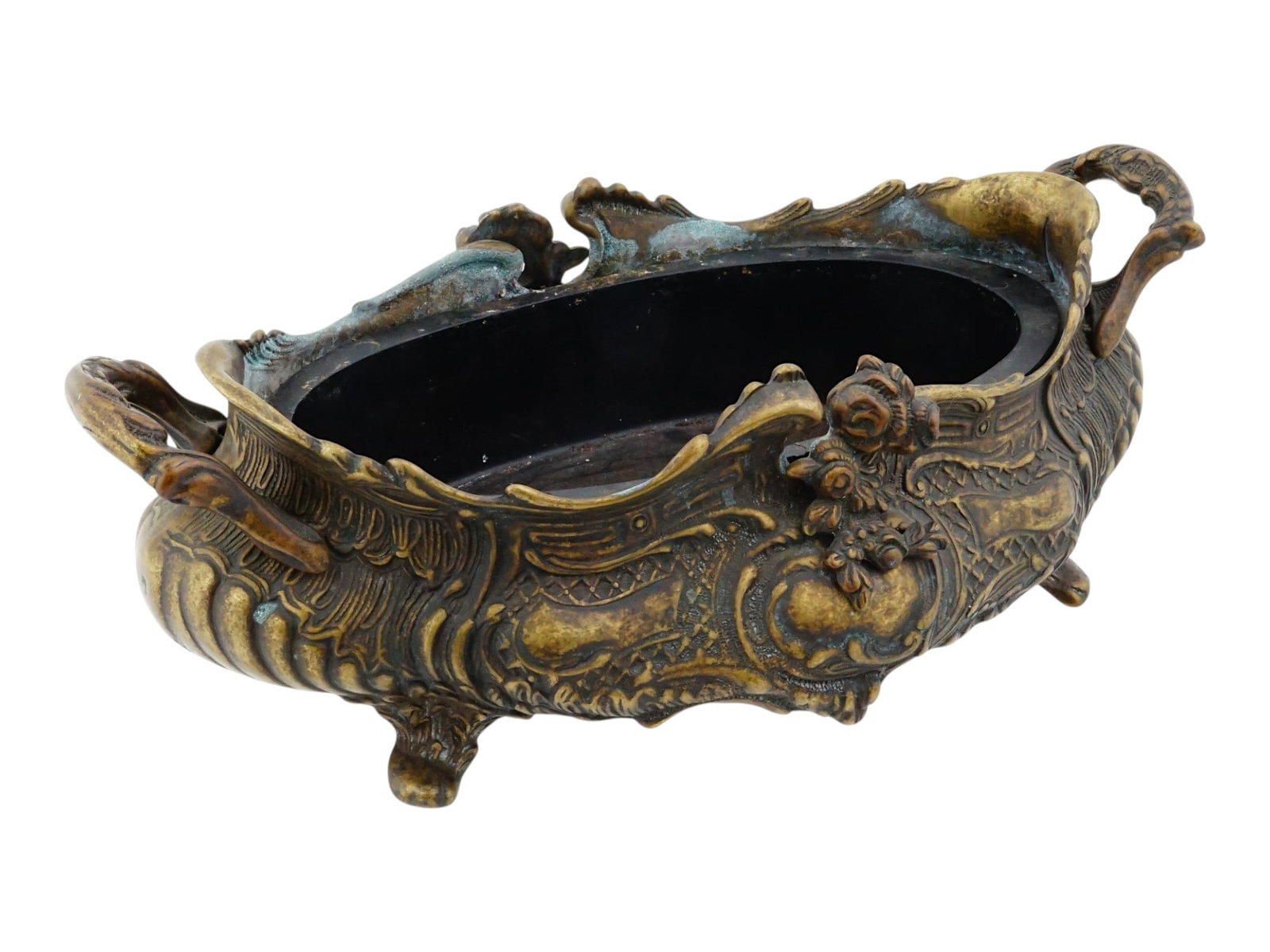 FRENCH ROCOCO STYLE BRONZE CENTERPIECE W HANDLES: A French Rococo style centerpiece, executed in cast bronze with an oval form and a scalloped, foliate molded rim. The exterior is decorated with intricate relief cast scrollwork, acanthus leaves, and 