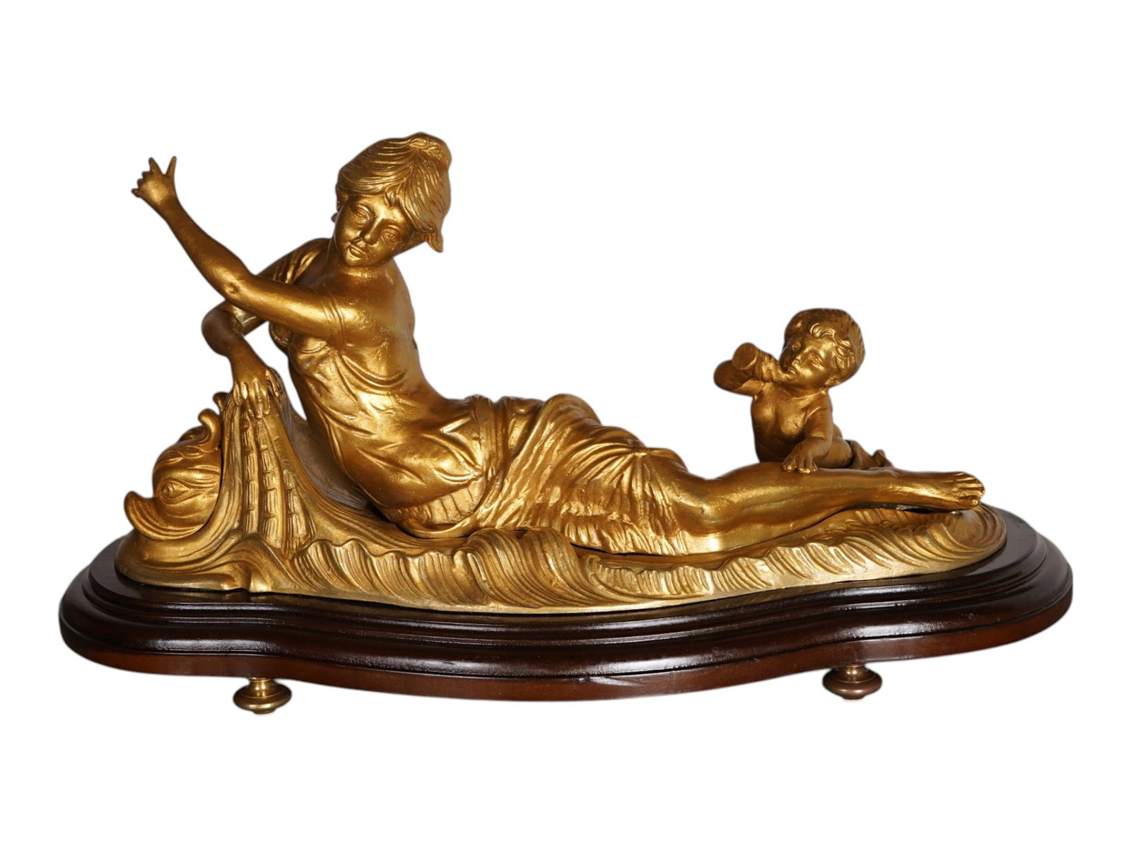 VINTAGE ITALIAN GILT BRASS FIGURINE NYMPH AND CUPID: A vintage Intalian gilt brass sculpture. Reclined draped female figure with a putto playing the horn. The piece is mounted on a footed wooden base. Unmarked. Collectible Sculpture And Decor, Figurines