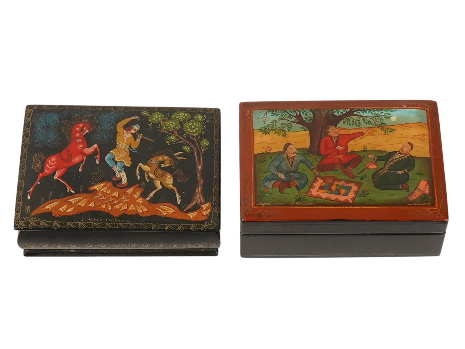 PAIR OF RUSSIAN MSTYORA LACQUERED TRINKET BOXES: A lot of two Russian Soviet era lacquered wooden trinket boxes of rectangular shape. Each piece is hand-painted. First. Titled Konyok-Gorbunok, signed with initials, Mstyora. Second. Titled The