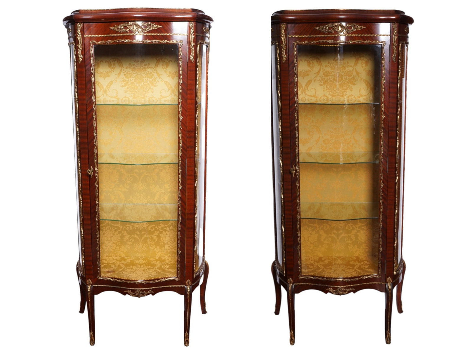 PAIR OF ANTIQUE FRENCH ORMOLU DISPLAY CABINETS: A pair of exquisite antique French Belle Epoque kingwood ormolu mounted display cabinets. Circa mid to late 19th century. The cabinets are crafted from kingwood with curved glass panels on figured leg