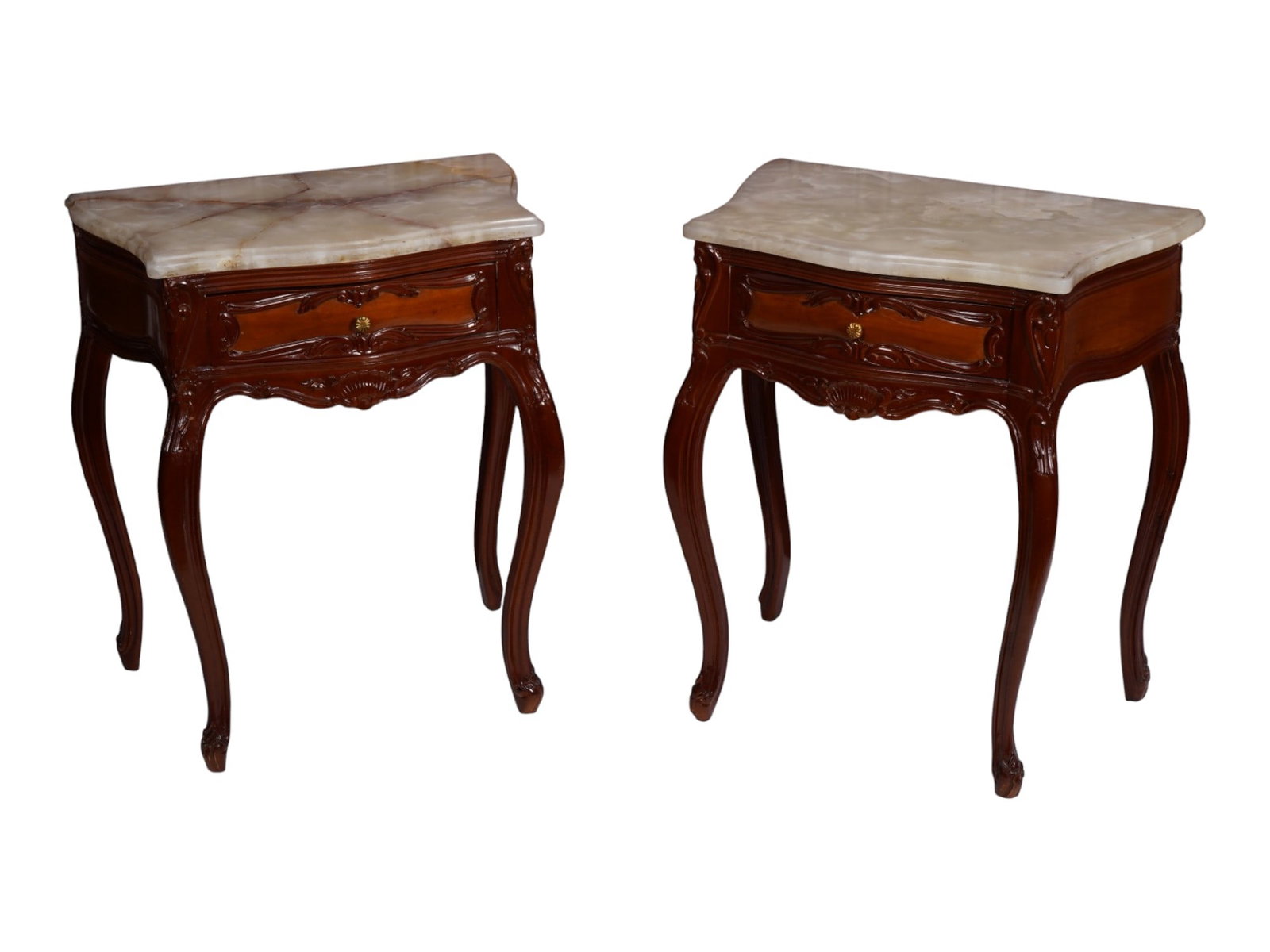 PAIR OF ANTIQUE FRENCH LOUIS XV REVIVAL BEDSIDE TABLES: A pair of antique French Louis XV Revival bedside tables with molded white and green onyx tops and wooden veneers. Each features a single drawer, carved rocaille ornament, and cabriole legs with scrol