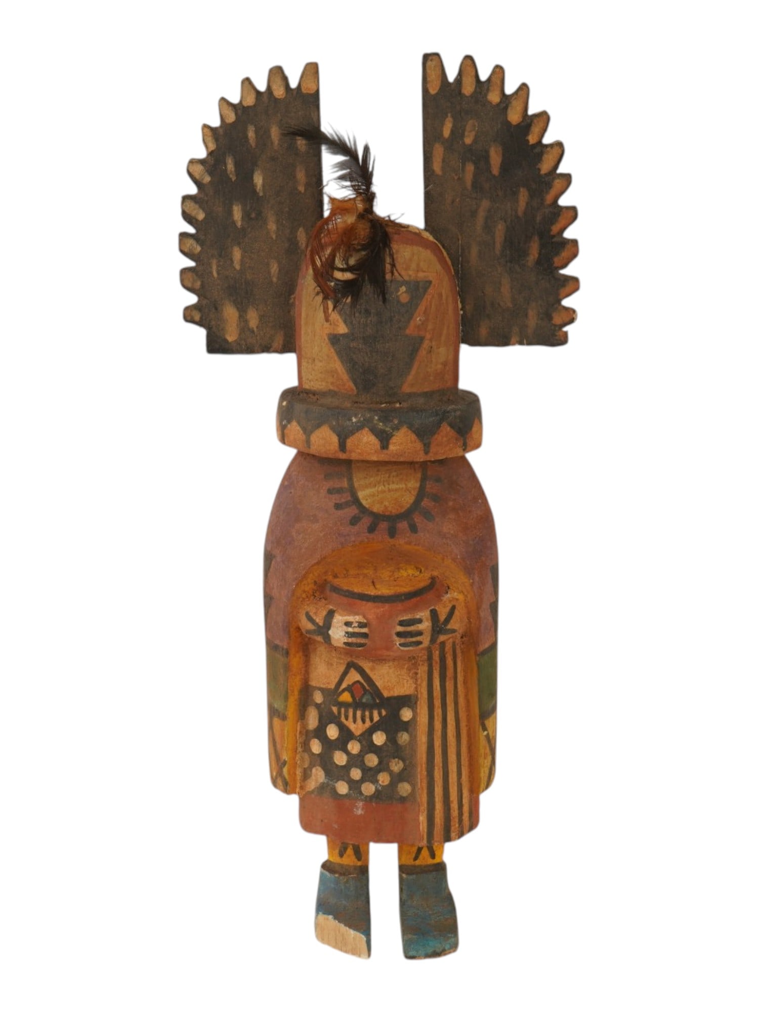 SOUTHWESTERN AMERICAN HOPI KATSINA DOLL CROW MOTHER: A traditional Hopi Katsina doll depicting the Angwusnasomtaqa, or Crow Mother, carved from a single piece of cottonwood root. The figure features the distinctive serrated crow-wing headdress and hand-