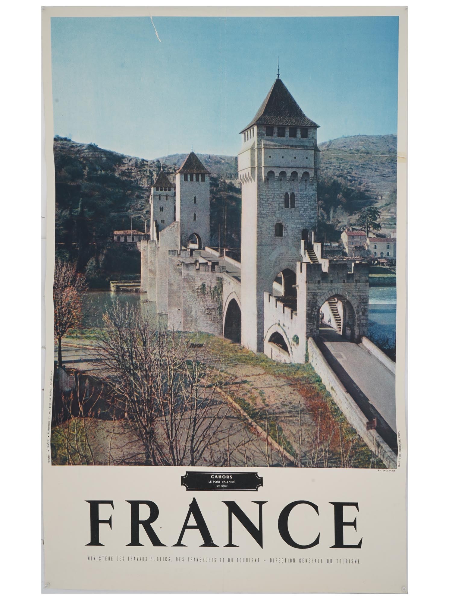 VINTAGE FRENCH TRAVEL ADVERTISING POSTER PONT VALENTRE: A vintage French travel advertising poster, promoting Cahors and the iconic Pont Valentre. This 14th-century stone bridge spans the Lot River, west of Cahors, France, and is renowned for its medieval 