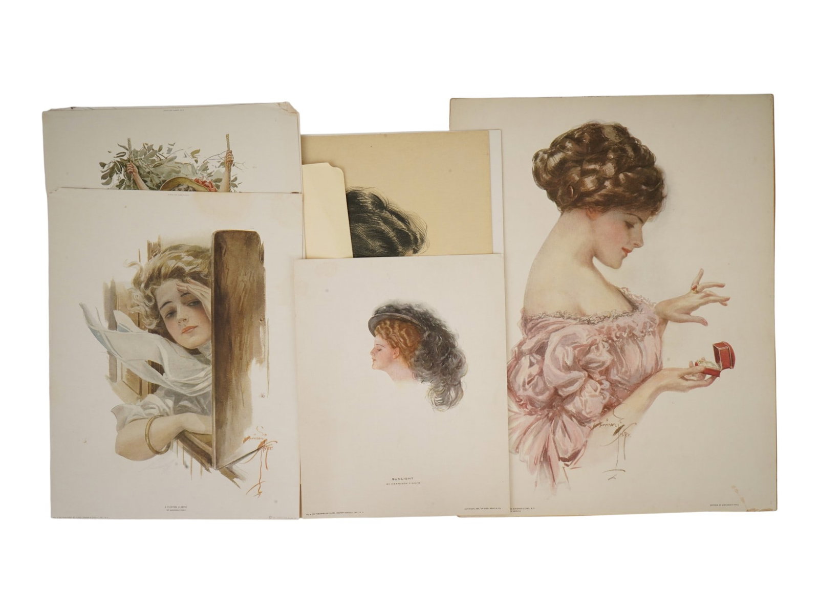 6 ANTIQUE AMERICAN PRINTS BY HARRISON FISHER: A lot of 6 antique American prints by Harrison Fisher, known for his depictions of Art Nouveau female portraits. Circa early 20th century. Published by Graham and Scully, Inc. New York, Reinthal and N