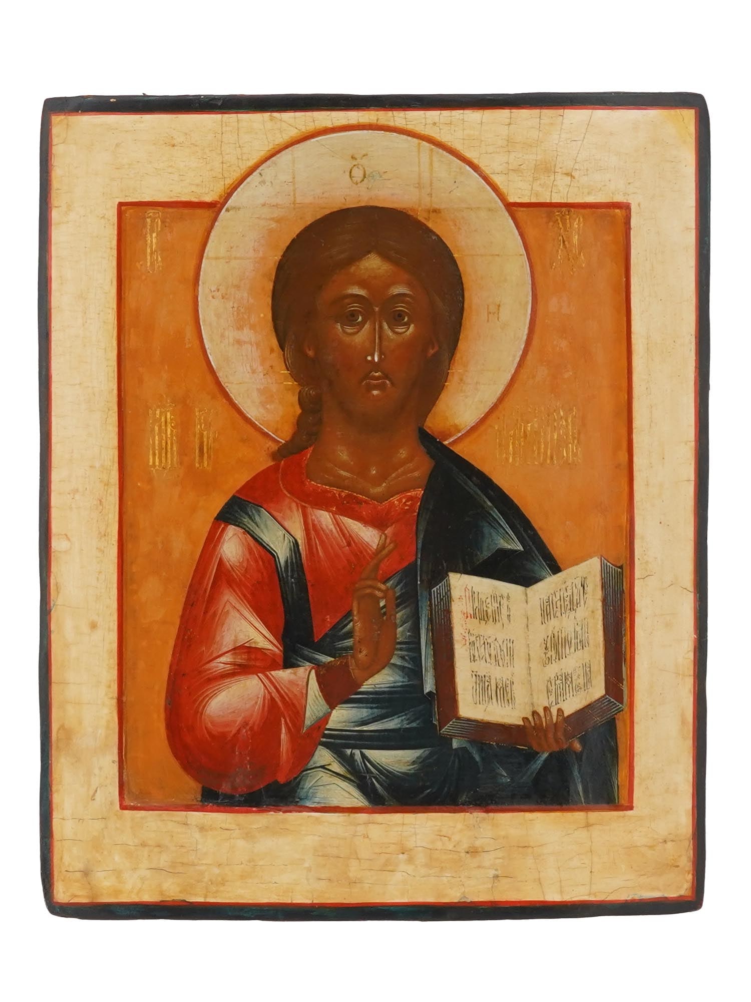 18TH CEN RUSSIAN ORTHODOX CHRIST PANTOCRATOR ICON: An 18th century Russian Orthodox hand painted icon of Christ Pantocrator. The icon depicts Christ holding the New Testament in his left hand and making the gesture of teaching or of blessing with his 