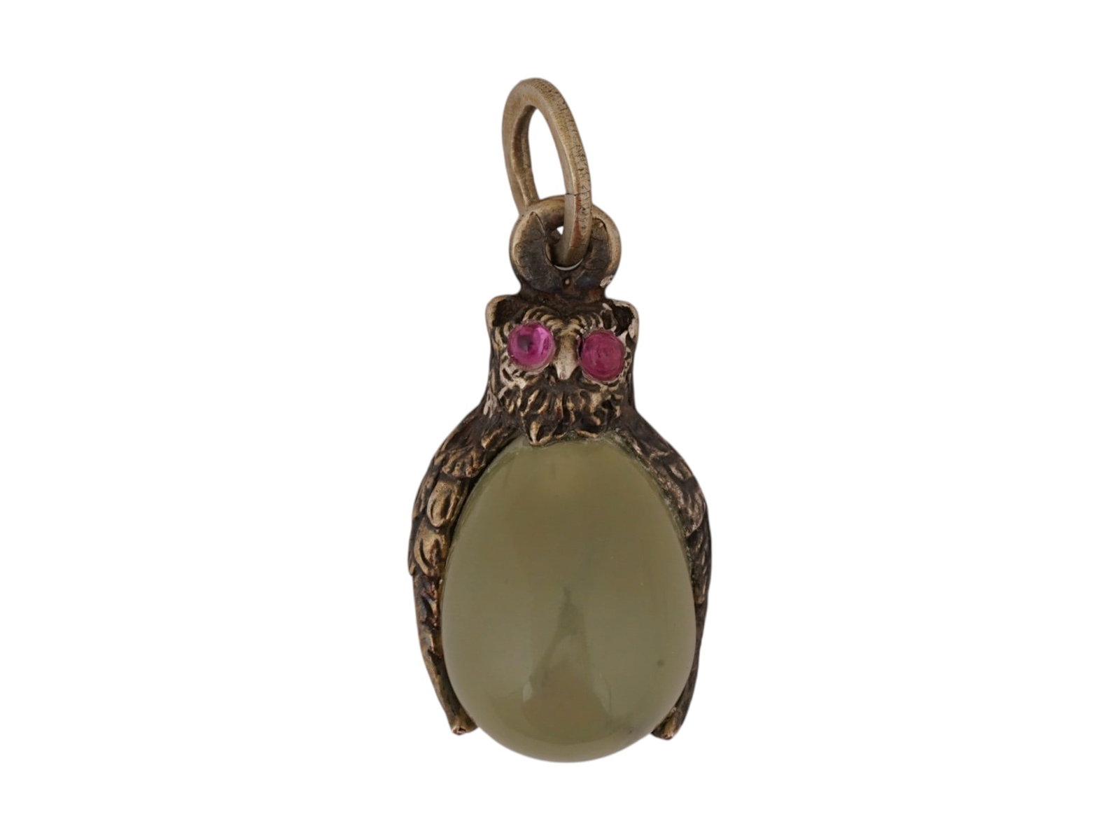 RUSSIAN SILVER JADE RUBY OWL EASTER EGG PENDANT: A Russian carved jade Easter Egg pendant. Figurative gilt silver upper part representing an owl with ruby eyes. Hallmark of 84 silver standard and makers mark are on the fitting ring. Total Weight: 5.