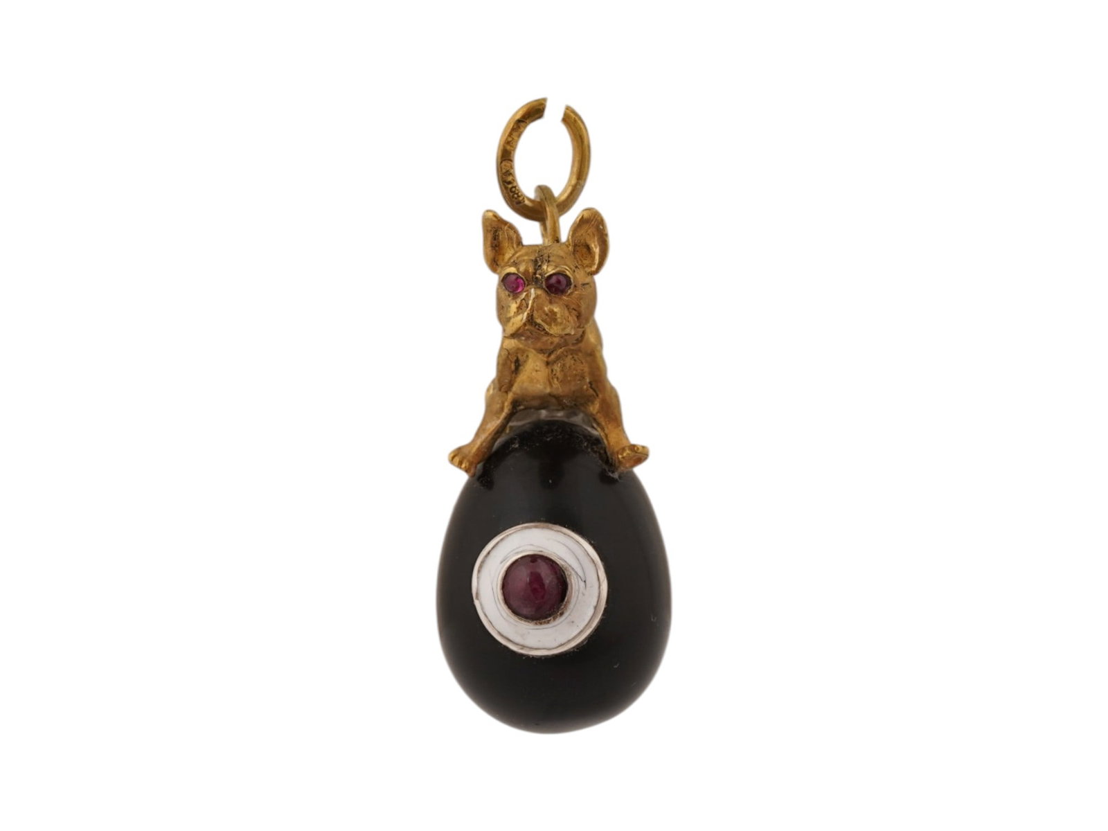 RUSSIAN SILVER BLACK JADE RUBY EASTER EGG PENDANT: A Russian carved black jade Easter Egg pendant. Ruby cabochon in white enamel framing on the obverse. Topped with a gilt silver bulldog figurine with ruby eyes. Hallmark of 88 silver standard and make