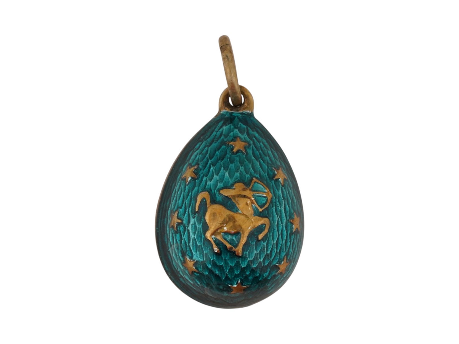 RUSSIAN SILVER GUILLOCHE ENAMEL EASTER EGG PENDANT: A Russian gilt silver Easter egg pendant decorated with a shimmering aquamarine guilloche enamel throughout. Features a relief image of a Sagittarius, an astrological sign, to the front side, with