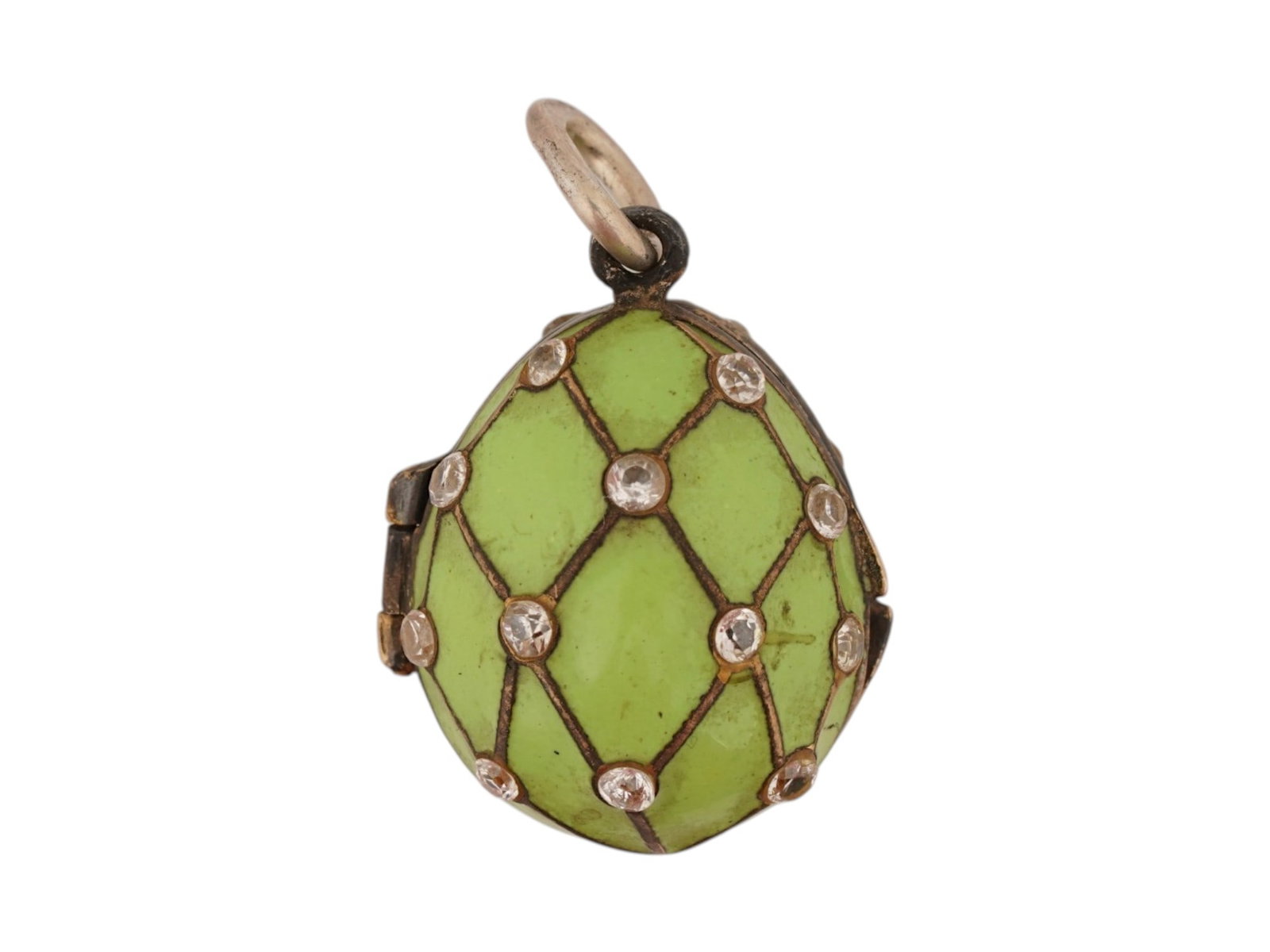 RUSSIAN SILVER ENAMEL EASTER EGG PENDANT W GEMSTONES: A Russian 88 Silver and enamel Easter egg locket pendant. The pendant is made in a mesh design, encrusted with gemstones, and covered with Guilloche enamel in a green shade. Marked with a Russian