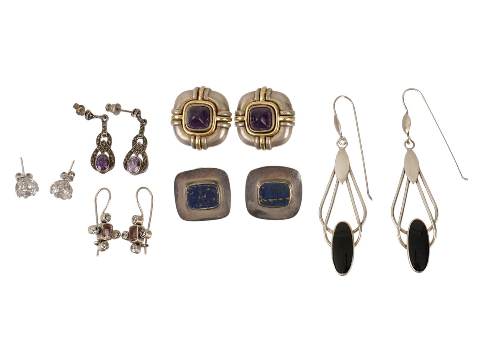 COLLECTION OF 14K GOLD AND STERLING SILVER EARRINGS: A collection of an assortment of earrings crafted from sterling silver and 14K gold, showcasing a variety of styles and stones. Included are purple stone set drop earrings, black stone wire dangles,