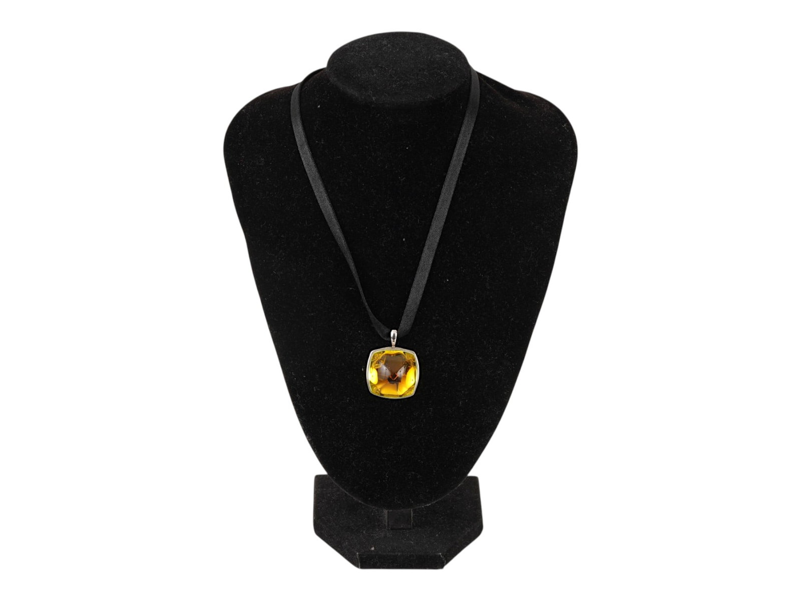 BACCARAT STERLING SILVER CRYSTAL NECKLACE: A vintage Baccarat pendant on a black ribbon. Yellow cushion-cut crystal in silver fittings. Sterling silver clasp, marked 925. Statement Costume Jewelry And Fashion Accessories For Women. THIS LOT