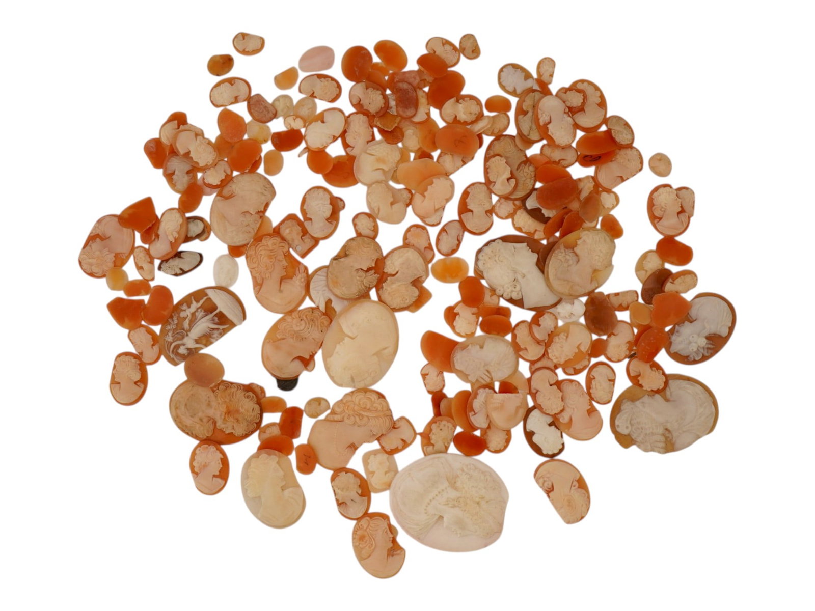 LARGE COLLECTION OF DAMAGED CONCH SHELL CAMEOS: A large collection of damaged hand carved cameo medallions. Each piece is crafted from a conch shell, and most depict female portraits in the Victorian manner rendered in high relief. The cameos are p