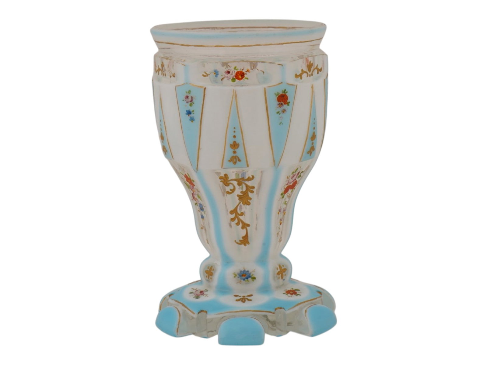 ANTIQUE BOHEMIAN GLASS HAND PAINTED FOOTED VESSEL: An antique Bohemian glass vessel constructed from white opaline glass featuring alternating vertical panels of opaque white and light blue. The exterior surface is embellished with hand painted polych