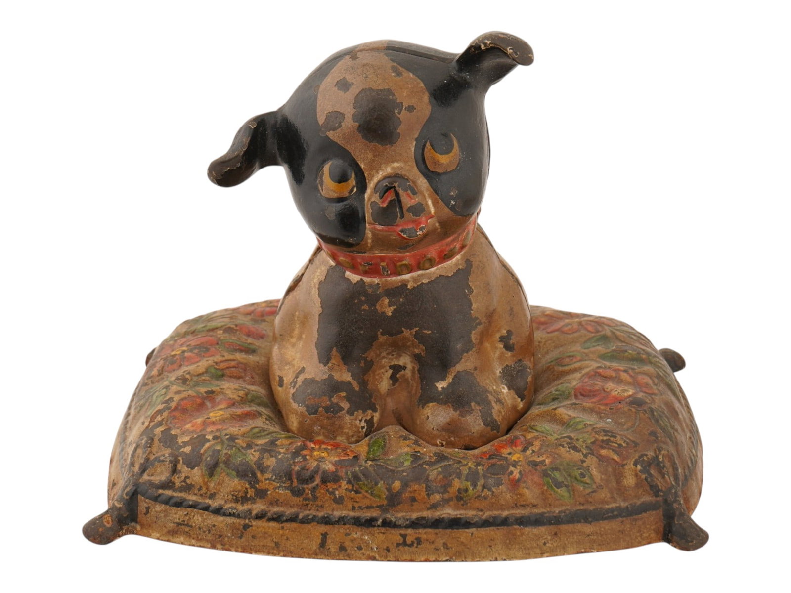 ANTIQUE AMERICAN CAST IRON COIN BANK BOSTON TERRIER: An antique cast-iron coin bank depicting a seated Boston Terrier or bulldog puppy wearing a Fido collar and resting on a floral-decorated cushion. Dating to the early 20th century. Antique American De
