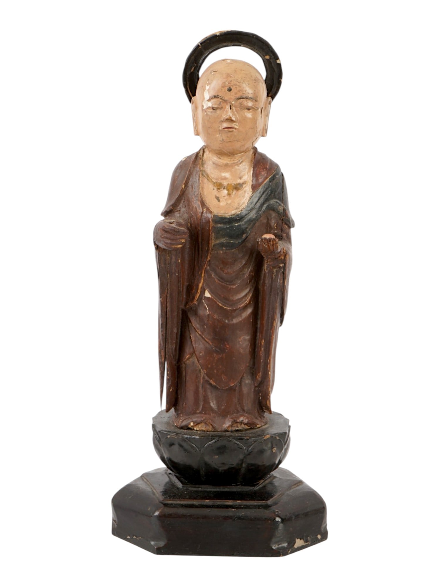 ANTIQUE ASIAN HAND PAINTED WOODEN FIGURINE: An antique Asian hand painted wooden figurine, likely depicts Jizo Bosatsu (Ksitigarbha Bodhisattva), one of the most revered deities in Japanese Buddhism. The circular halo behind the head signifies 