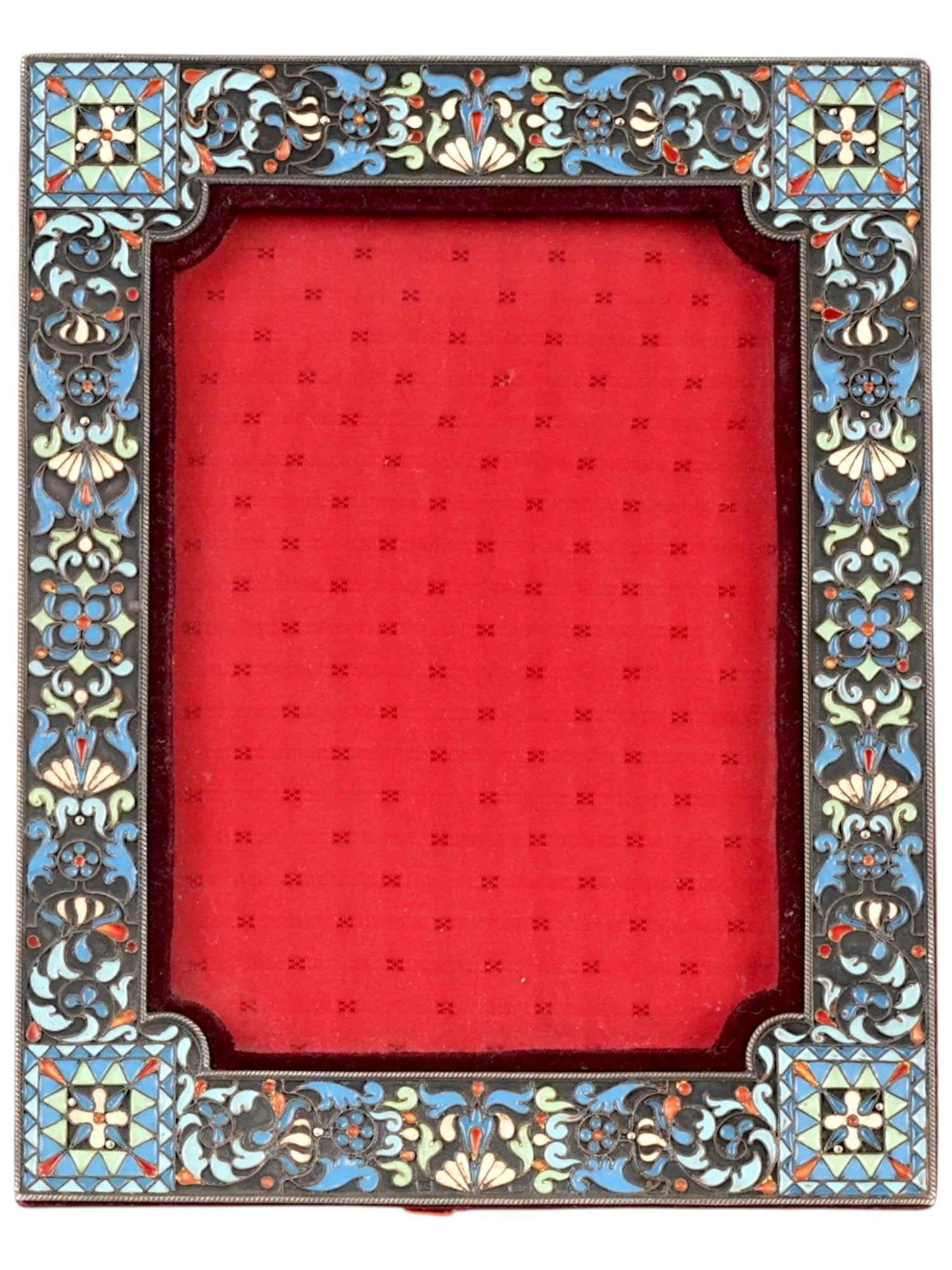 RUSSIAN SILVER AND CLOISONNE ENAMEL PICTURE FRAME: A Russian 84 silver and enamel picture frame. The piece is adorned with polychrome enamel floral, foliage, foliate scroll, and geometrical ornaments made in the Cloisonne technique. The backside of