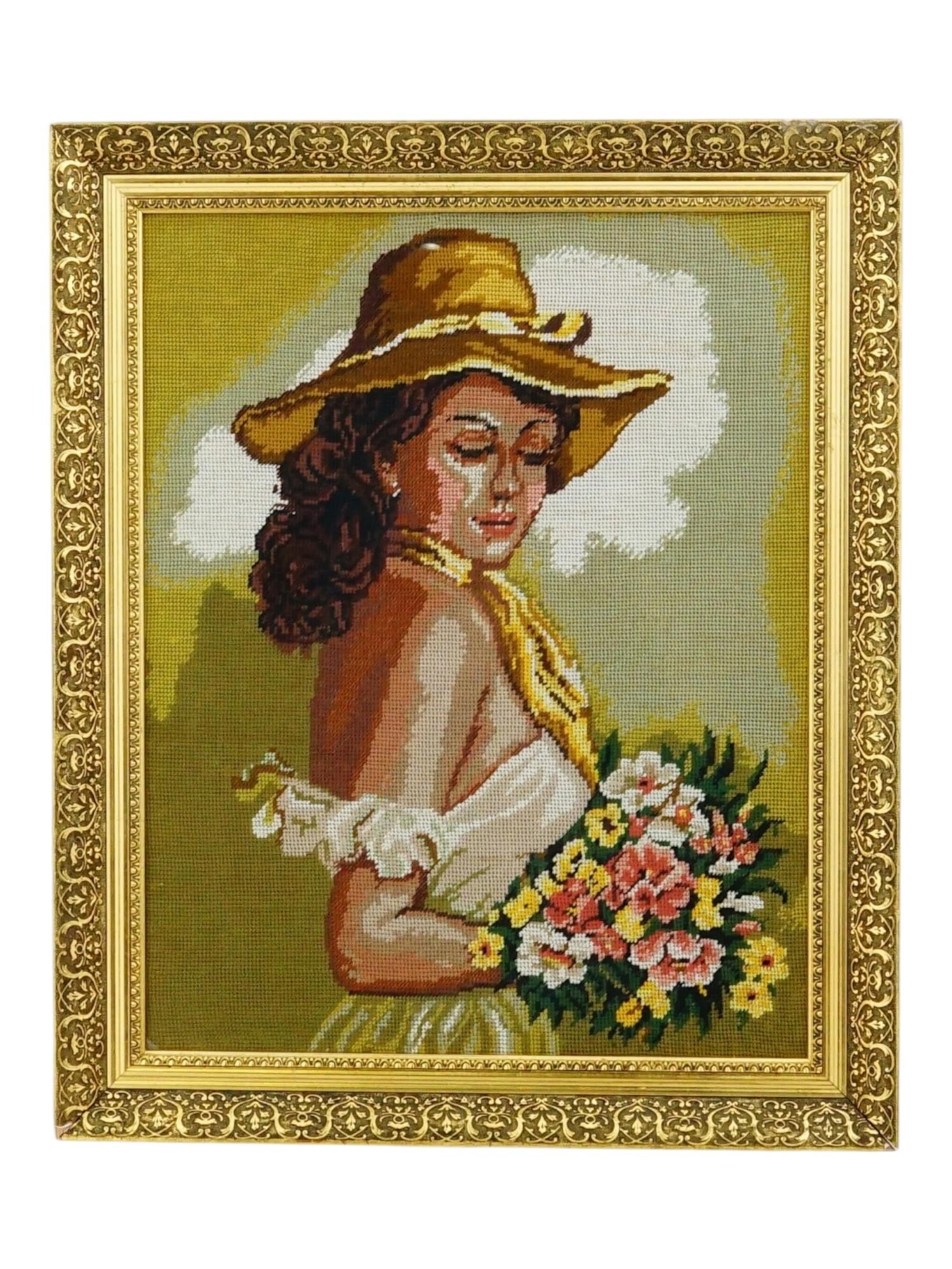 VINTAGE FEMALE PORTRAIT EMBROIDERY FRAMED: A vintage hand-embroidered artwork on canvas executed in the half-stitch technique. Portrait of a woman in hat, with a bouquet of flowers. Framed. Collectible Wall Art Decor, Portraiture, Needlework. 