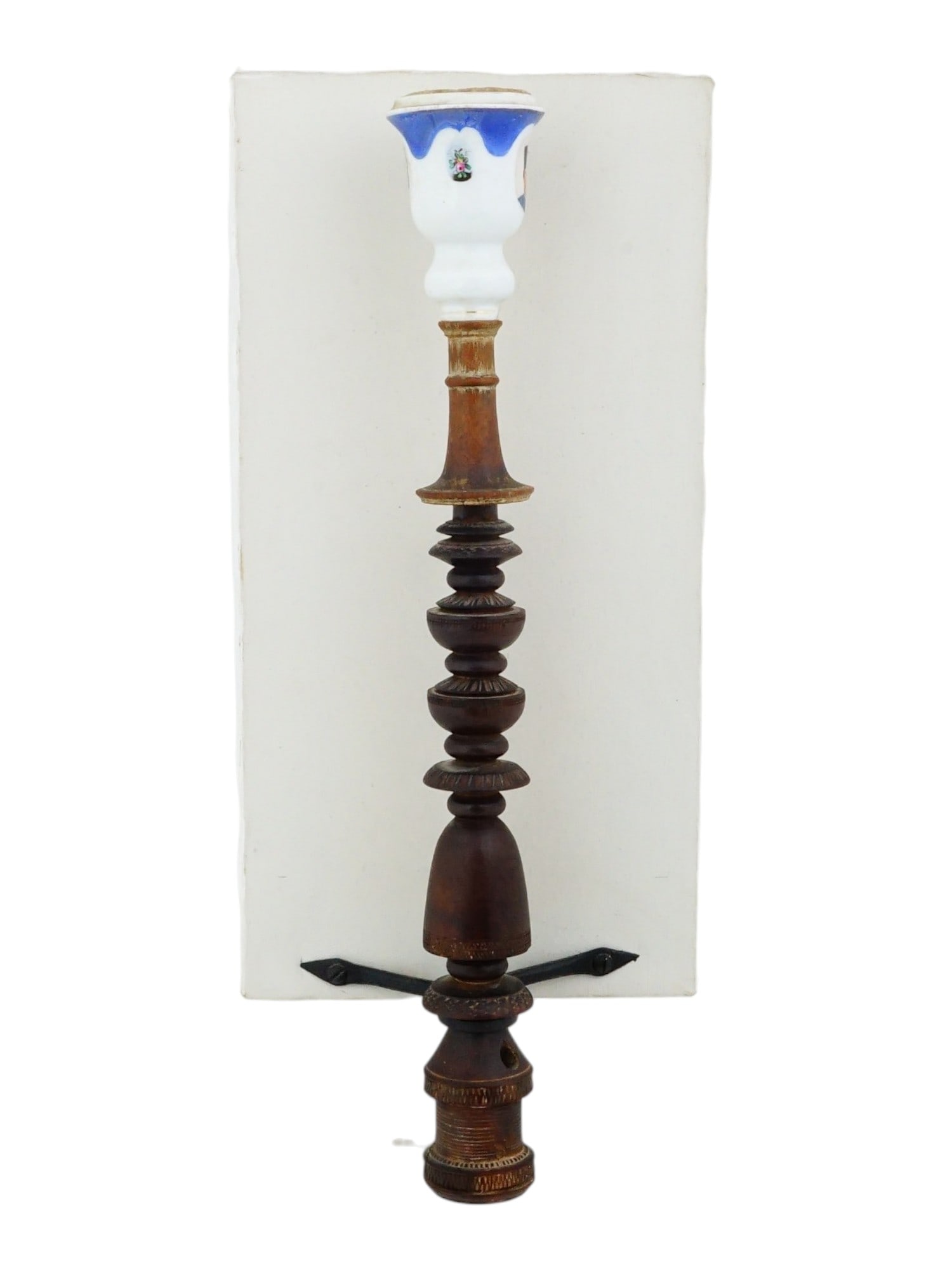 VINTAGE PERSIAN PORCELAIN QALYAN CUP WITH STAND: A vintage Persian porcelain qalyan bowl or cup. The bowl features a portrait of Naser ad-Din Shah Qajar and floral panels. Mounted on a wooden hookah stand. Qalyan is the Persian term for hookah or