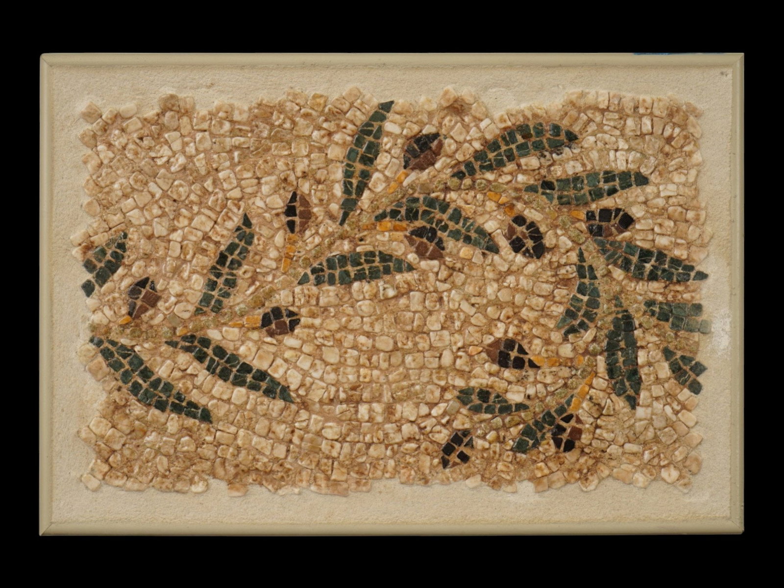 ANCIENT ROMAN EMPIRE MOSAIC OF AN OLIVE BRANCH: An ancient Roman mosaic artwork composed of tesserae pieces. Imperial era, ca. 100 to 300 AD. The piece represents an olive branch. Framed. Historical Collectibles And Archaeological Relics, Applied A