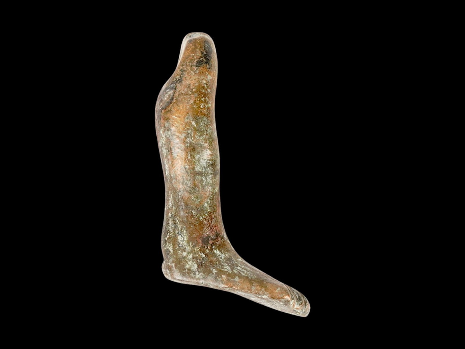 ANCIENT ROMAN EMPIRE VOTIVE BRONZE LEG PENDANT: An Ancient Roman bronze pendant, a leg-shaped votive object. Imperial Rome era, ca. 100 BC to 300 AD. Votive offerings were made at the temple of a healing god such as Asklepios, the Greco-Roman god o