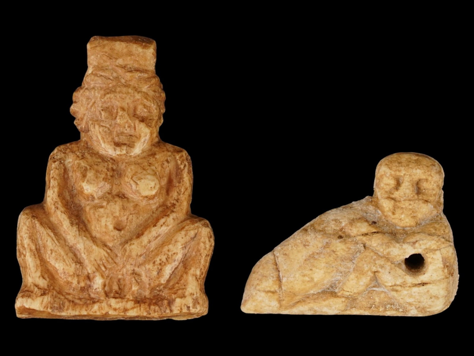 PAIR OF ANCIENT EGYPTIAN STONE EROTIC PENDANTS: A pair of Ancient Egyptian carved stone pendants, shaped as a male figure with a pronounced phallus and Mother goddess giving birth. Late Period, 26th Dynasty to Ptolemaic Egypt, ca. 700 to 200 BC. Hi