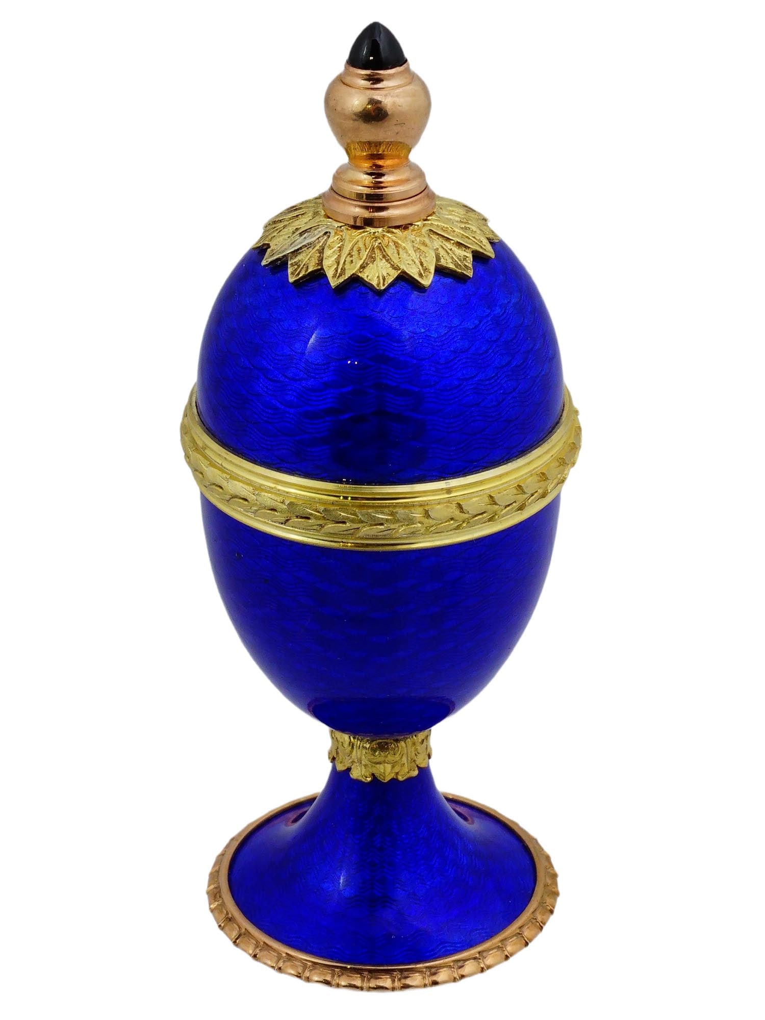RUSSIAN SILVER GUILLOCHE ENAMEL PERFUME BOTTLE: A Russian gilt silver egg-shaped perfume bottle. Footed piece. Blue guilloche enamel surface. Gemstone cabochon finial. Hallmark of 88 silver standard and makers mark are on the bottom. Collectible Si