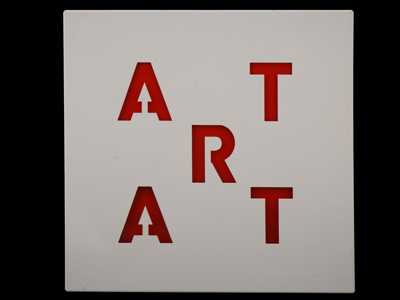 VINTAGE ART METAL WALL HANGING ARTWORK: A vintage metal wall hanging artwork. The item features two layers of red and white metal creating the word ART in a square of intersecting letters. Decorative Pieces For Home Decor. THIS LOT IS ELIGI