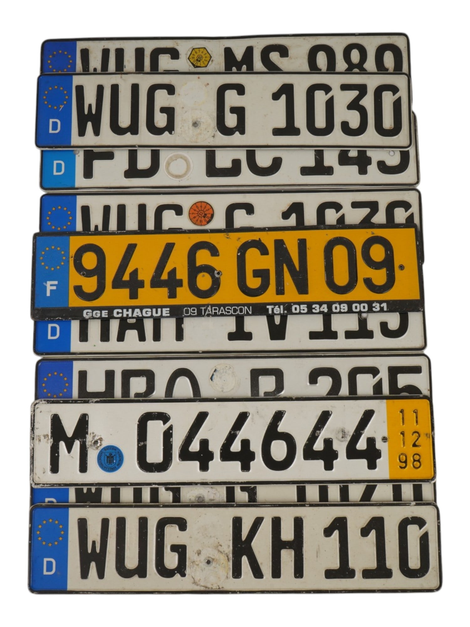 VINTAGE GERMAN AND FRENCH VEHICLE REGISTRATION PLATES: A collection of vintage German and French vehicle registration plates. A total of 10 items. The Euro-style plates retain their original registration markings, state seals, and inspection stickers. Car