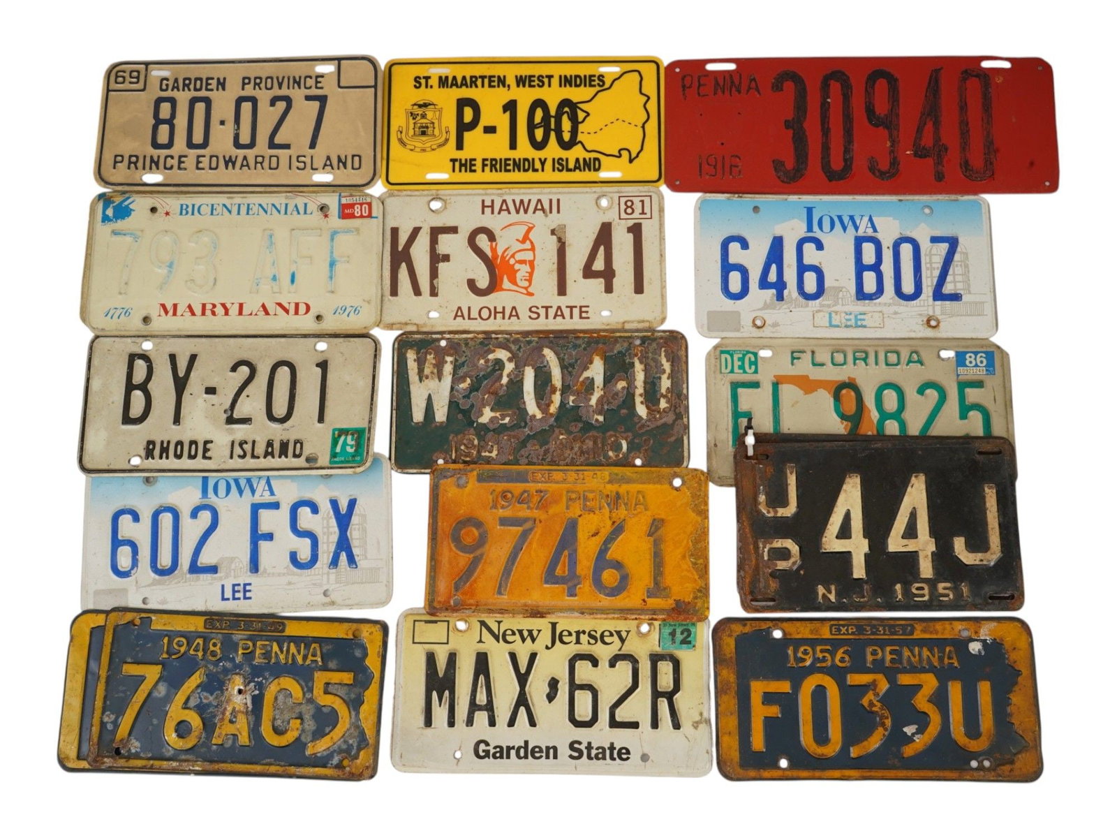LOT OF 20 US LICENSE PLATES FROM VARIOUS STATES: A collection of twenty United States license plates from various jurisdictions including New Jersey, Connecticut, Maryland, Iowa and Florida. The assortment features stamped metal plates with diverse 