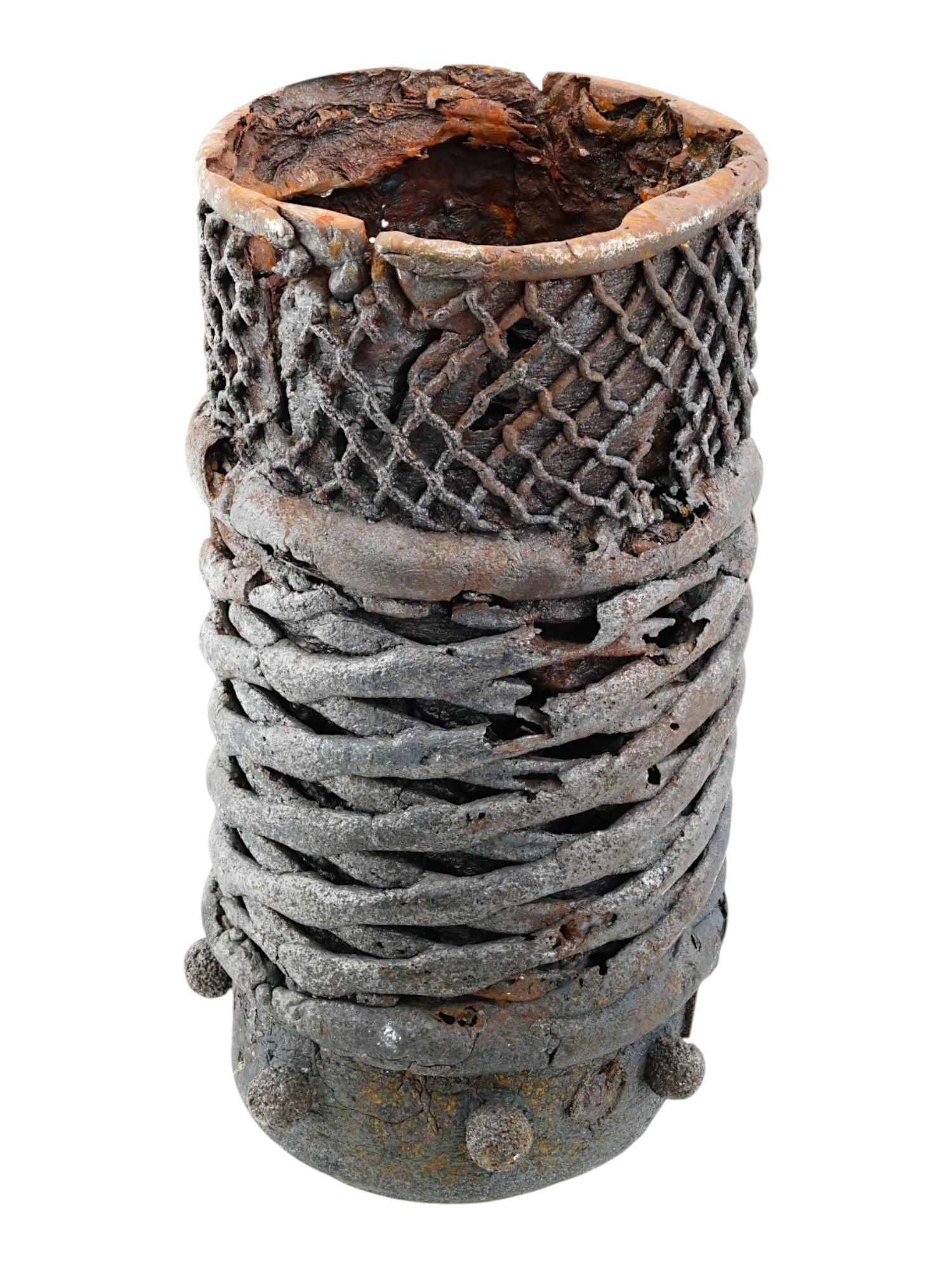 AMERICAN SAND CASTING IRON SCULPTURE VASE BY MEL HANTZ: A sculptural vessel by Mel Hantz is executed in sand cast iron, characterized by a complex, multi tiered surface texture. The upper section features a delicate openwork lattice motif, transitioning in