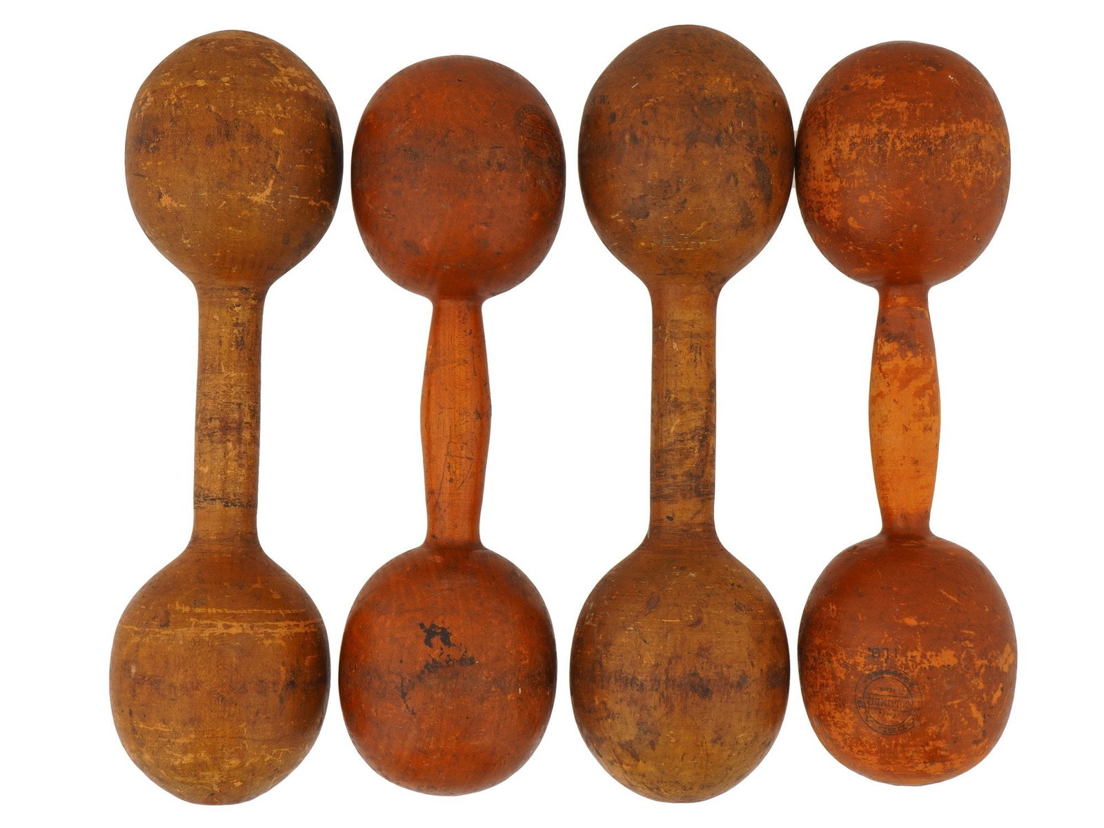 LOT OF ANTIQUE WOODEN DUMBBELLS COLUMBIA SPALDING: A lot of four antique old-style fixed wooden dumbbells from the 1910s to 1920s, each weighing 1 lb. They are lighter and easier on joints, warmer to the touch, and have decorative value. Markungs: Col