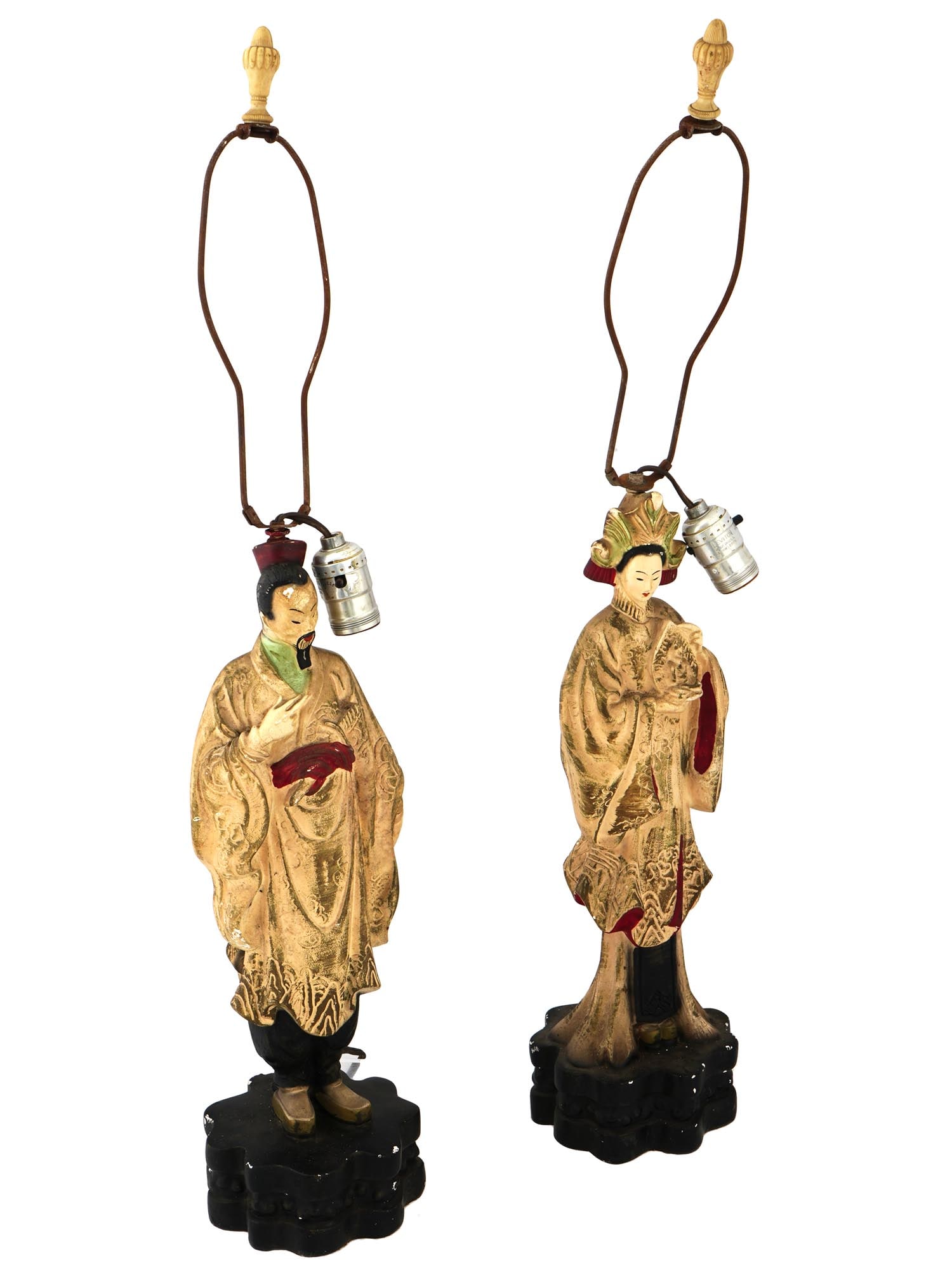 PAIR OF VINTAGE CHINESE CHALKWARE FIGURINE LAMPS: A vintage pair of hand painted chalkware lamps featuring a traditional couple dressed in national attire. Each detailed figurine stands on a black base, complete with electric fittings. Circa the mid 