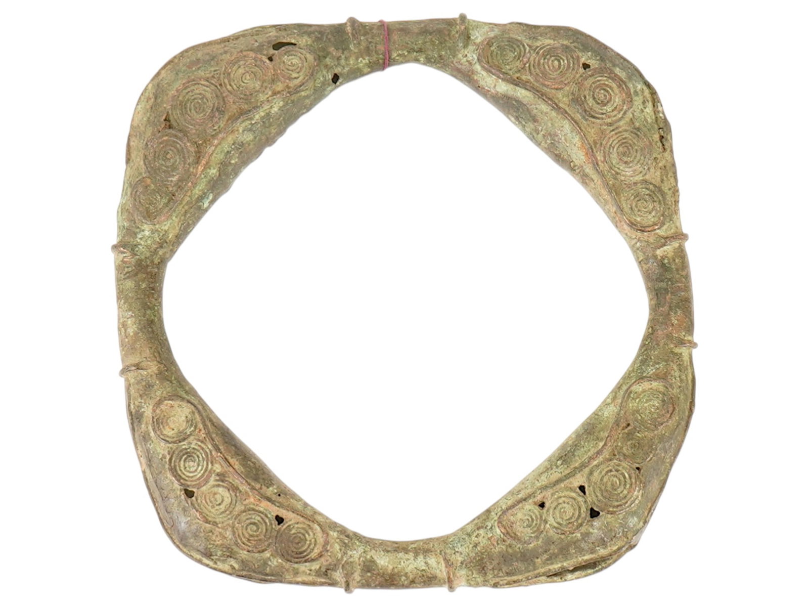 AFRICAN ENGRAVED BRONZE ANKLE RATTLE BRACELET: An African bronze anklet rattle bracelet probably from the Yoruba people. These anklets, called saworo, were traditionally worn on the ankles of high ranking officials, priests. The surface is decorat