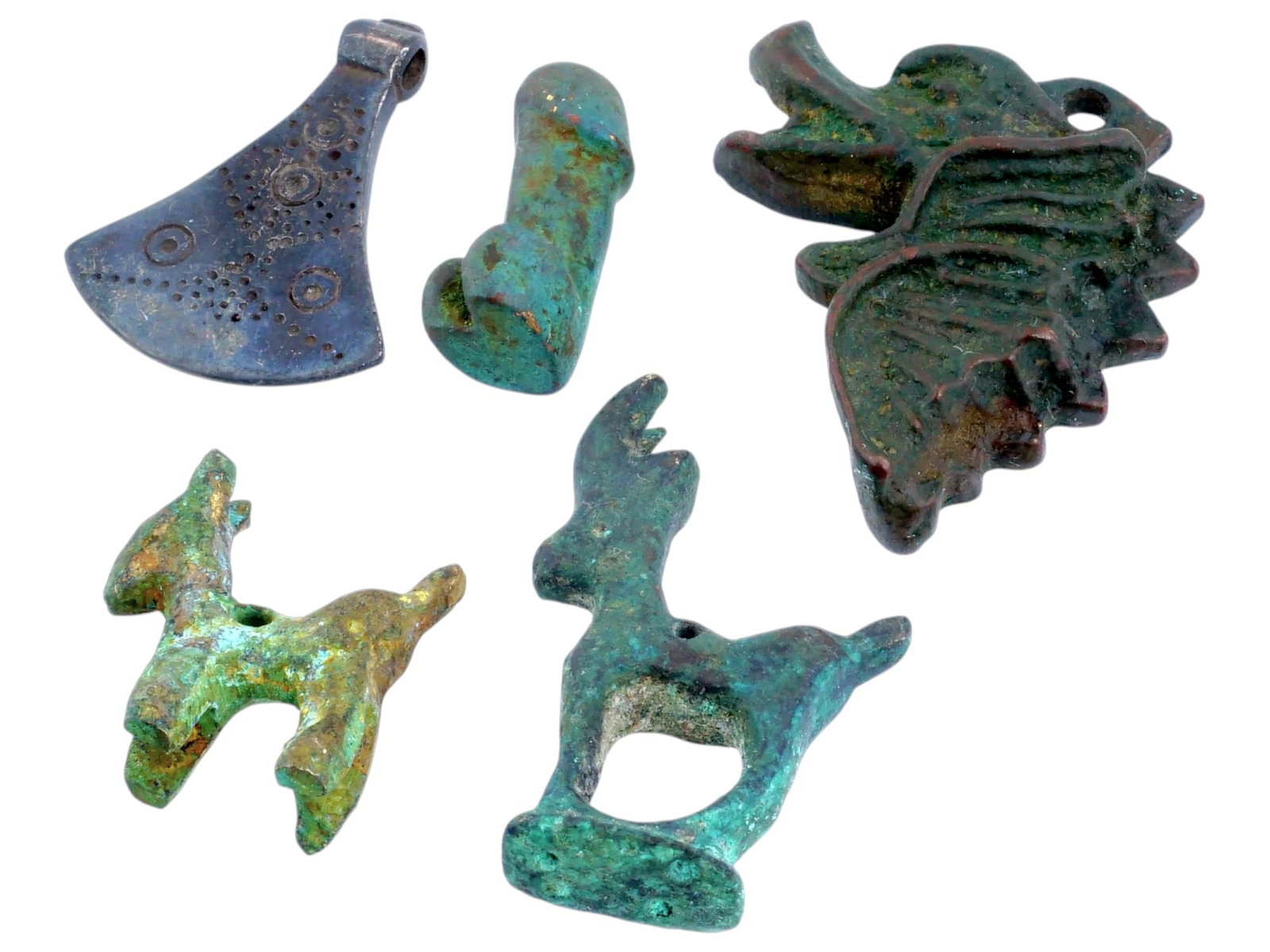 GROUP OF ANCIENT STYLE BRONZE PENDANTS AND FIGURINES: A group of ancient style bronze artifacts, each with distinct shapes and designs. The artifacts include: a small ax shaped piece, a phallic symbol, a stylized dragon head figurine, and two animal figu