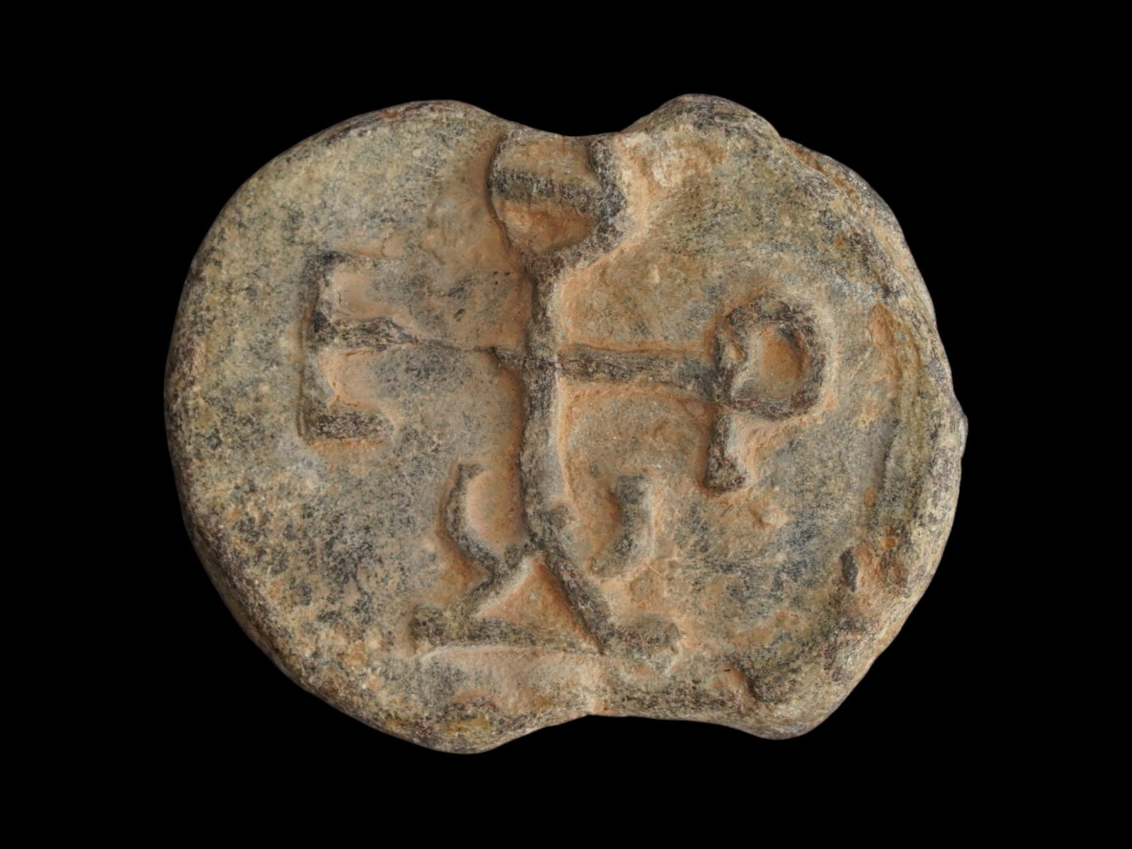 ANCIENT BYZANTINE MARY AND CHRIST LEAD SEAL: An Ancient Byzantine Empire lead seal, possibly intended for a bottle. Dating back to ca. 400 to 600 AD. The seal depicts Mary and Christ with two crosses on the obverse and a cross monogram on the re