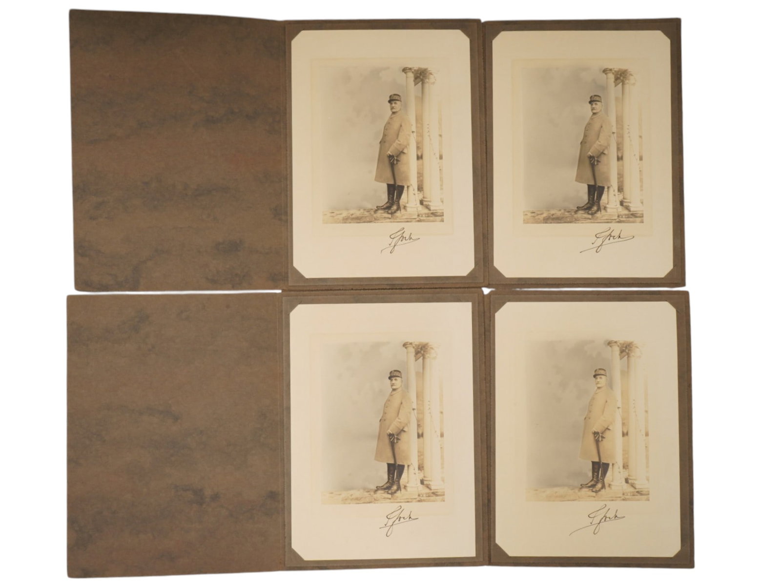 LOT OF PHOTOS OF FERDINAND FOCH BY FRANK MOORE SIGNED: A collection of four full length hand tinted portrait photographs by Frank Moore depicting Ferdinand Foch, showing him in overcoat, boots, and uniform cap bearing the characteristic bands of oak leave