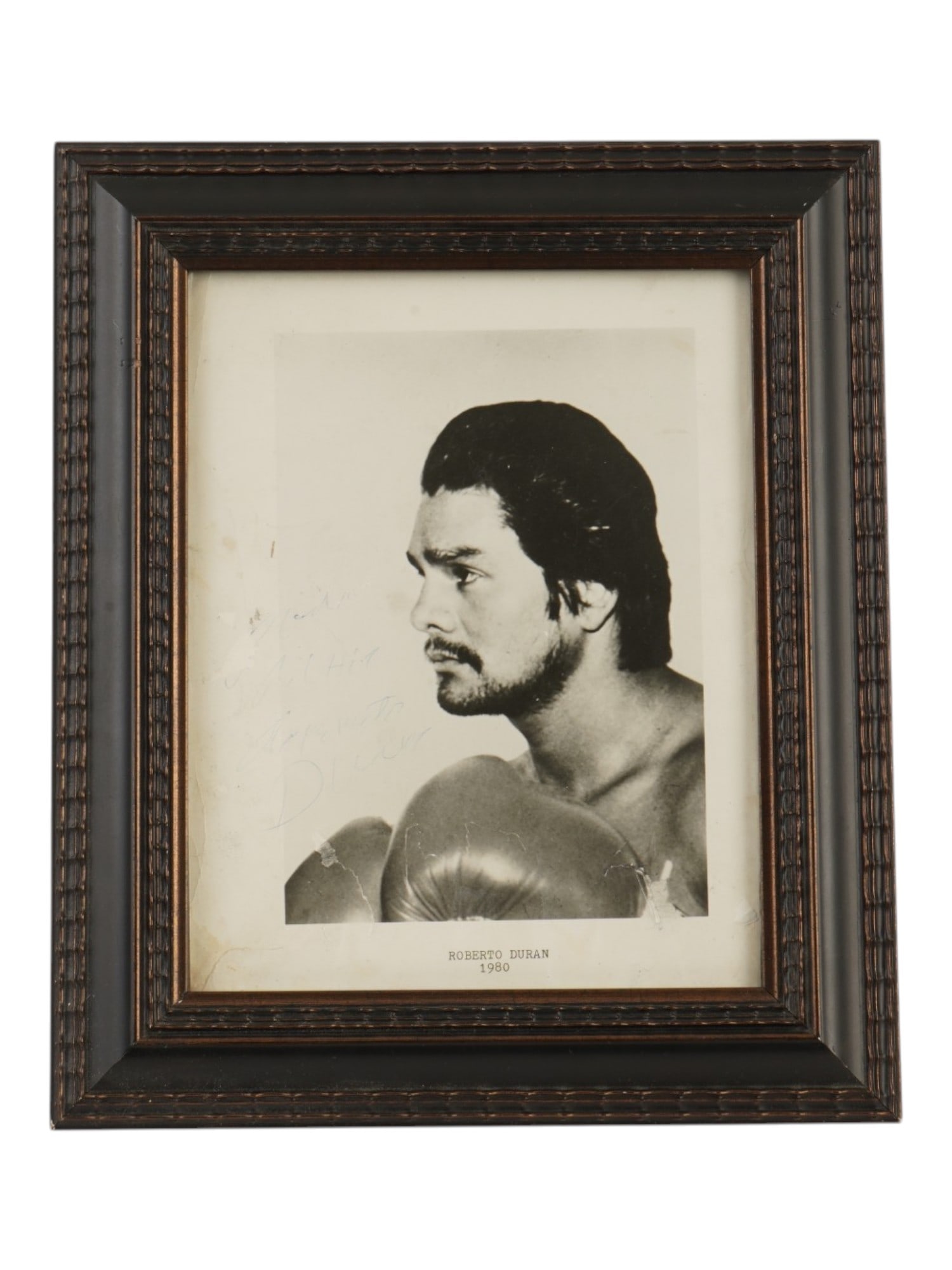 VINTAGE PHOTOGRAPH 1980 ROBERTO DURAN AUTOGRAPHED: A vintage promotional photograph of Panamanian boxing legend Roberto Duran, capturing him at the height of his career before his historic welterweight championship bout with Sugar Ray Leonard. The por