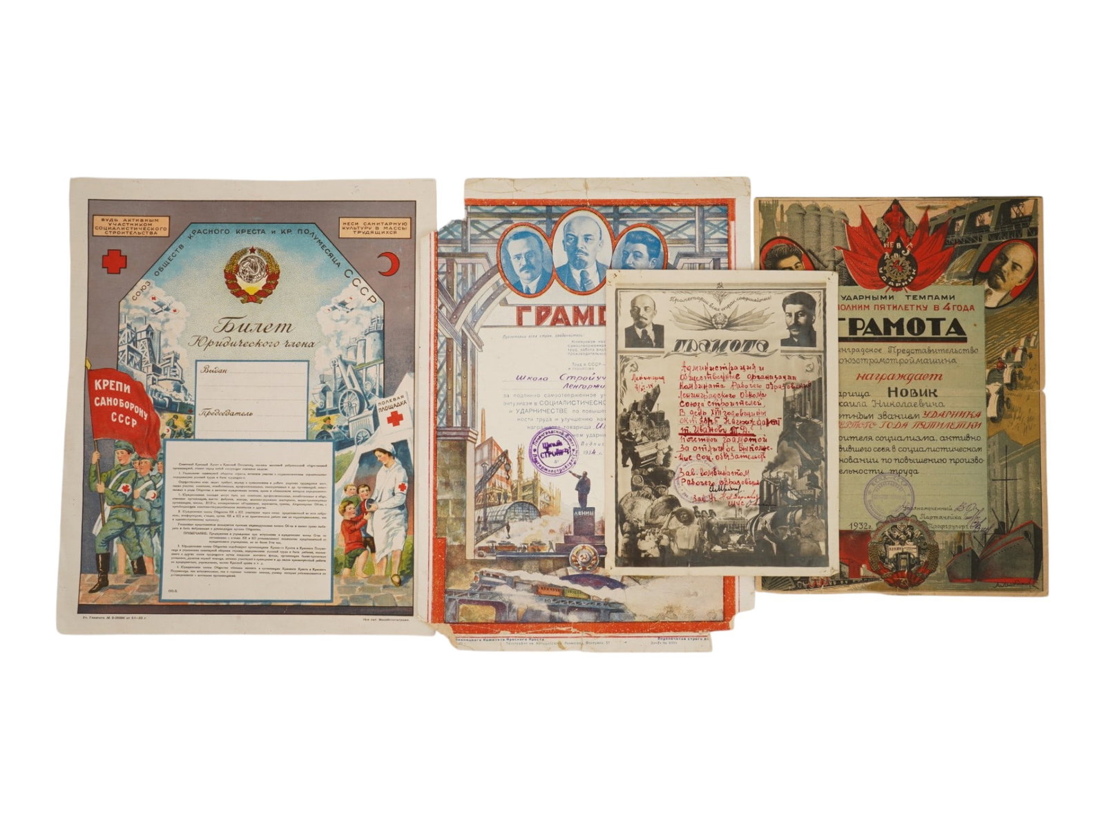 LOT OF 1930S RUSSIAN SOVIET ERA DIPLOMAS: A lot of four Russian Soviet era diplomas and documents. Three diplomas awarded for impact work at the factory, 1932-1934. Ticket of a legal member of the Union of the Red Cross and Red Crescent of th