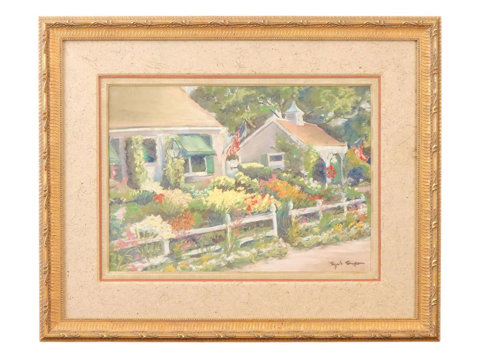 PASTEL PAINTING OF PROVINCETOWN SIGNED: A pastel on paper painting depicting a house with a garden. The scene features two buildings, surrounded by a profusion of colorful flowers in shades of pink, yellow, orange, and white. Framed by an o