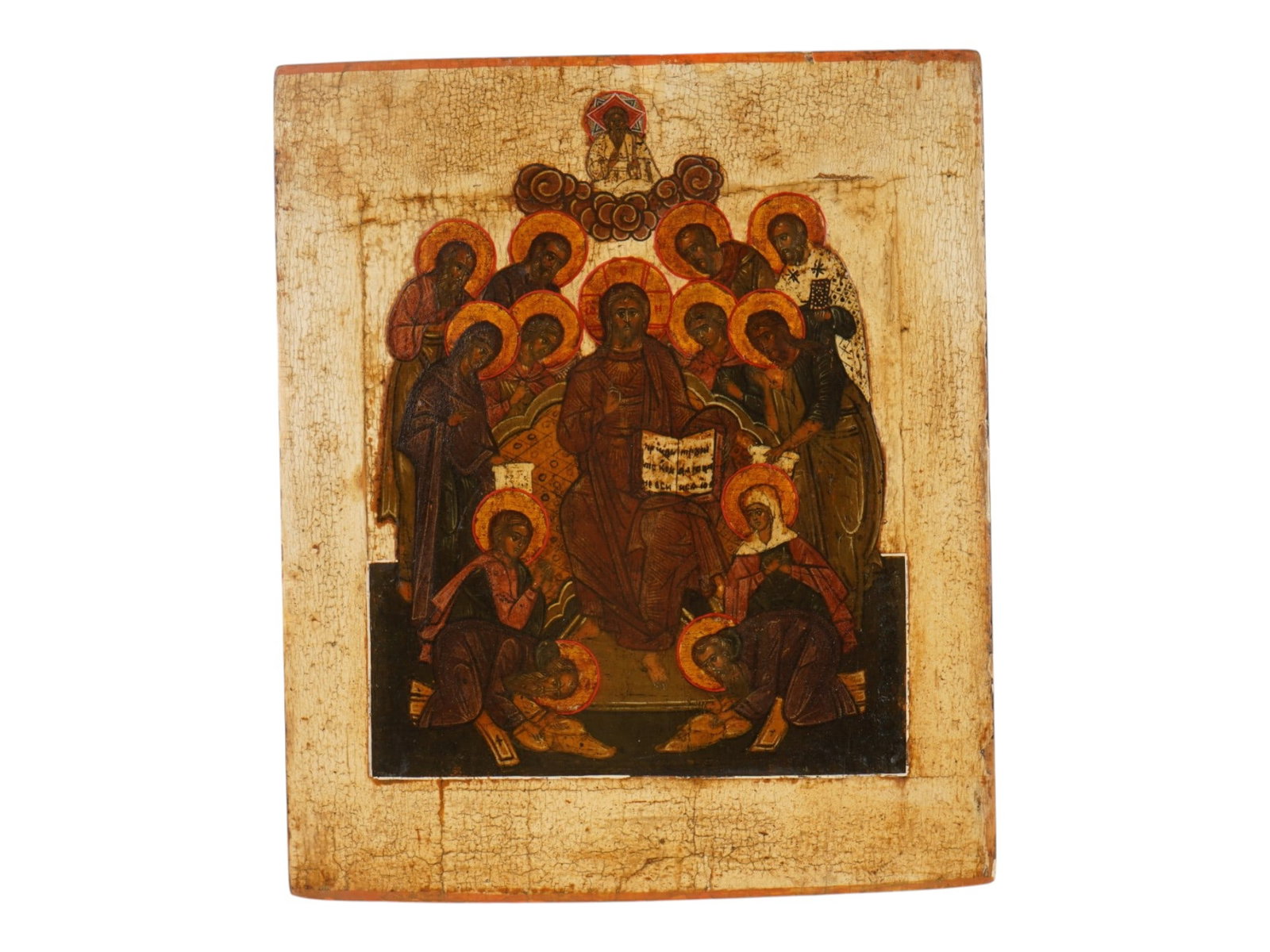 ANTIQUE 18TH C RUSSIAN ICON OF DEESIS AND SAINTS: An antique 18th-century Russian Orthodox icon representing the Deisis or Deesis. The icon depicts Christ Pantocrator seated on a throne with an open Gospel and his right hand in blessing. Surrounding 