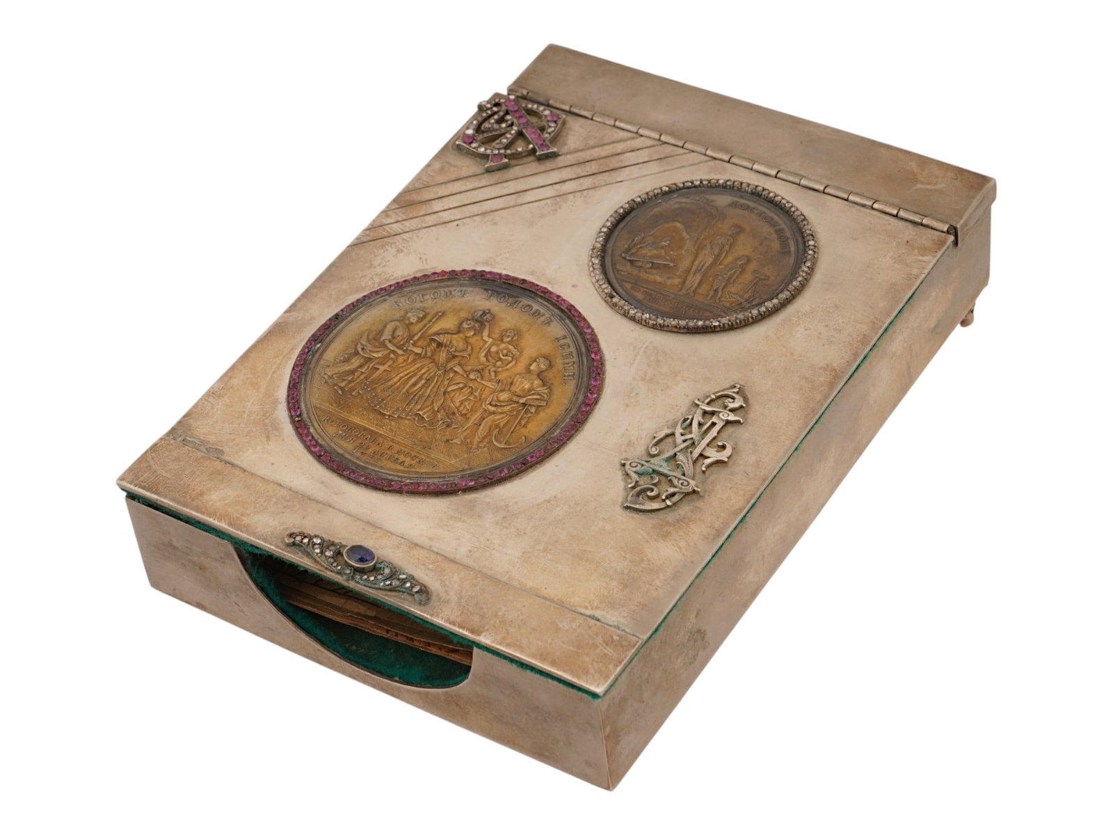 ANTIQUE RUSSIAN SILVER BOX W DIAMONDS AND GEMSTONES: An antique Russian silver document box with diamonds and gemstones. The rectangular lidded box is decorated with a raised ornament and an applied monogram set with diamonds and pink gemstones. Two