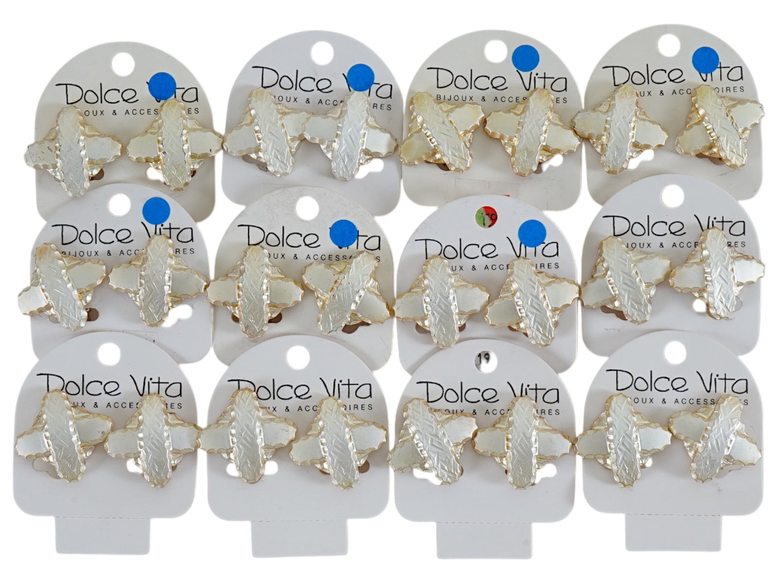 LOT OF FRENCH DOLCE VITA COSTUME JEWELRY CLIP EARRINGS: A collection of twelve pairs of vintage French Dolce Vita Paris costume jewelry clip earrings. Presumably made in the 1980s. The silver tone earrings are made in a raised crossed design. Displayed on 