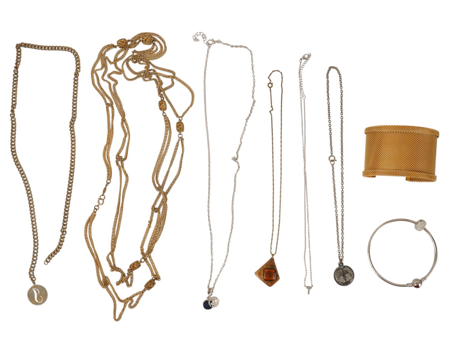 LOT OF VINTAGE LADIES COSTUME JEWELRY NECKLACES: A lot of vintage costume jewelry. A total of 8 items including pendants, chain necklaces, and two bangle bracelets. Statement Costume Jewelry For Women. THIS LOT IS ELIGIBLE FOR A 30-DAY UNCONDITIONAL
