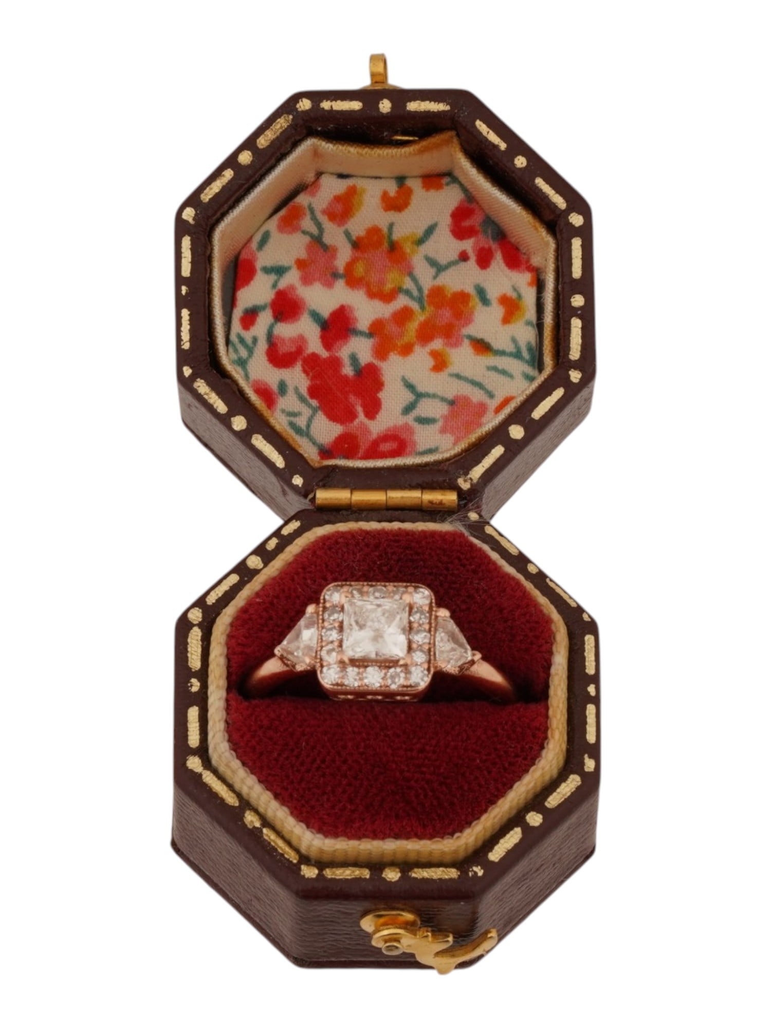 RUSSIAN 14K PINK GOLD RING WITH DIAMONDS IOB: An antique Russian 14K rose gold ring with diamonds. The ring is square at the top and features a central princess-cut diamond surrounded by smaller diamonds, as well as two triangular diamonds on the