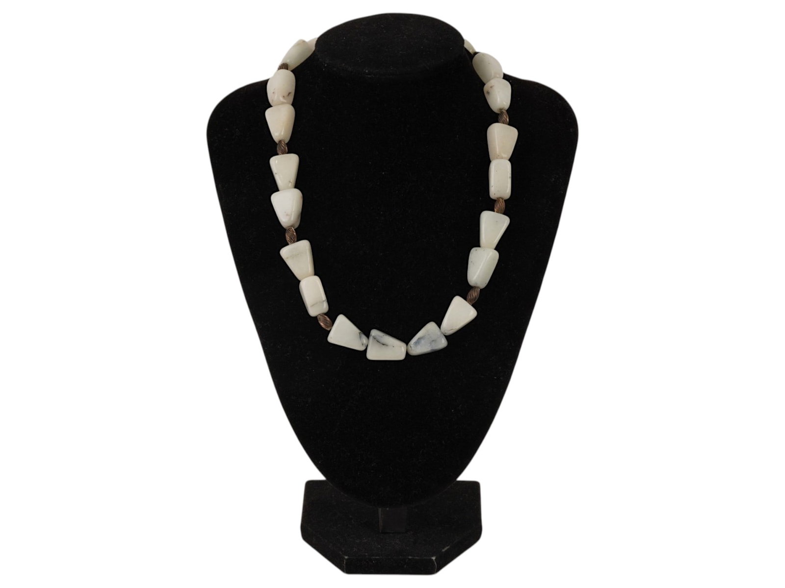 VINTAGE COSTUME COLLAR NECKLACE WITH GEOMETRIC BEADS: A vintage costume collar necklace featuring graduated geometric beads in soft cream tones. The bold design incorporates triangular and trapezoidal elements separated by decorative spacers. Finished wi
