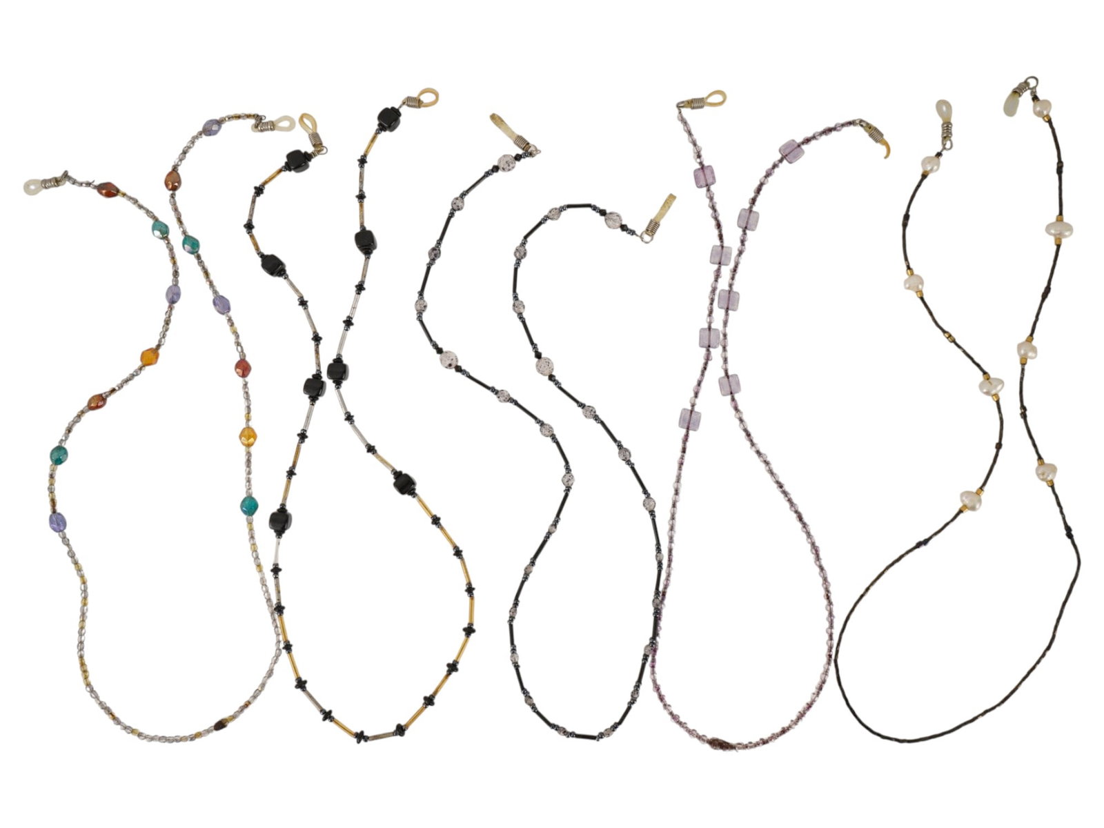 VINTAGE COSTUME FASHION BEADED EYEGLASS CHAINS: A group of six vintage costume beaded eyeglass chains designed as functional fashion accessories. The assortment includes colorful, geometric, seed bead, pearl-style, and monochromatic designs. Each c