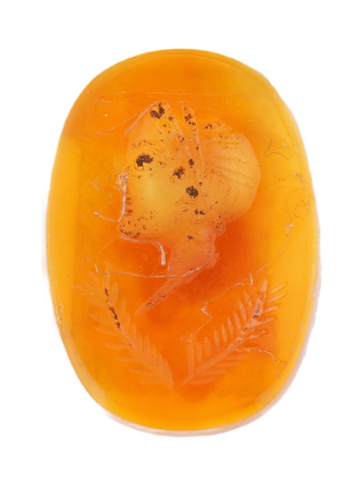 ANTIQUE VICTORIAN CARVED CARNELIAN INTAGLIO SEAL: An antique Victorian carved carnelian intaglio seal, oval in form, depicting a portrait of a female figure with two palm branches below. Executed in the traditional intaglio technique, the design is e