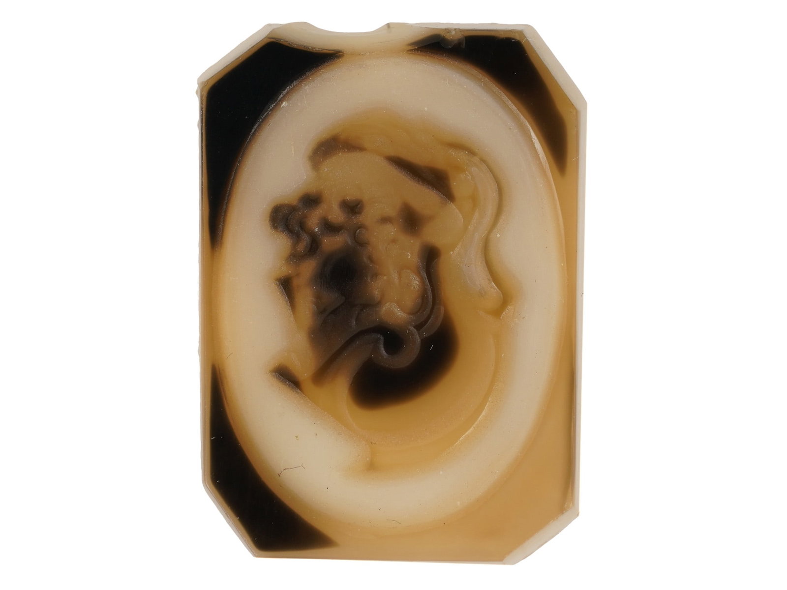 RECTANGULAR SHAPED PORTRAIT CAMEO W CANTED CORNERS: A rectangular shaped cameo with canted corners is carved from a multi layered hardstone. The subject depicts a male portrait in profile rendered in the Neoclassical style. The reverse is flat and unpo