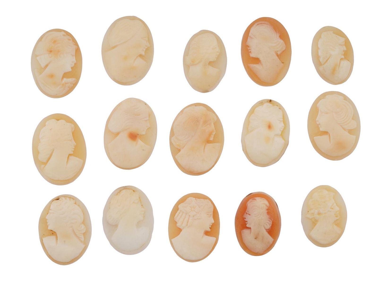 ANTIQUE VINTAGE CARVED SHELL CAMEOS W FEMALE PORTRAITS: A set of 15 antique or vintage carved shell cameos featuring high-relief female portraits, executed in a traditional classical style associated with Victorian-era jewelry. The loose unmounted pieces d