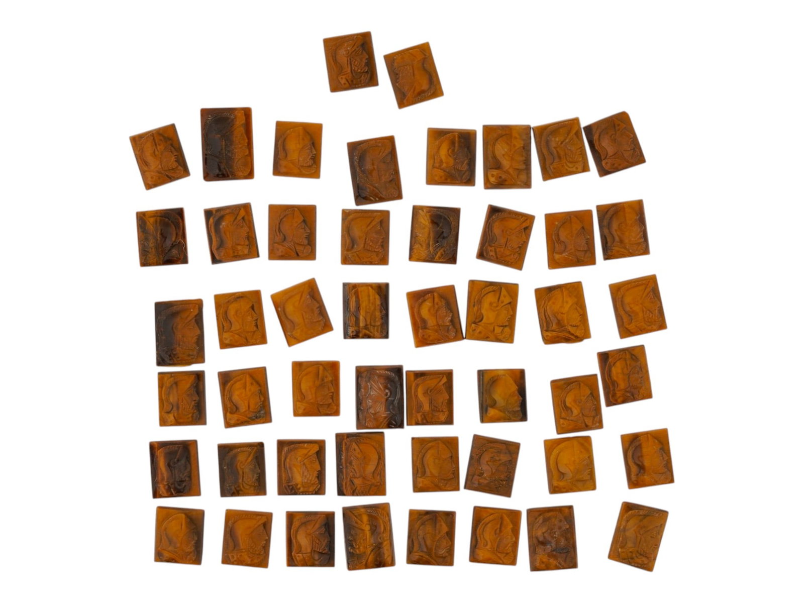 ANTIQUE HAND CARVED TIGERS EYE WARRIOR CAMEO PLAQUES: A collection of antique hand-carved Tigers Eye warrior cameo plaques. Each rectangular plaque is carved in high relief, showcasing its distinctive golden-brown chatoyancy and rich layered coloration. 